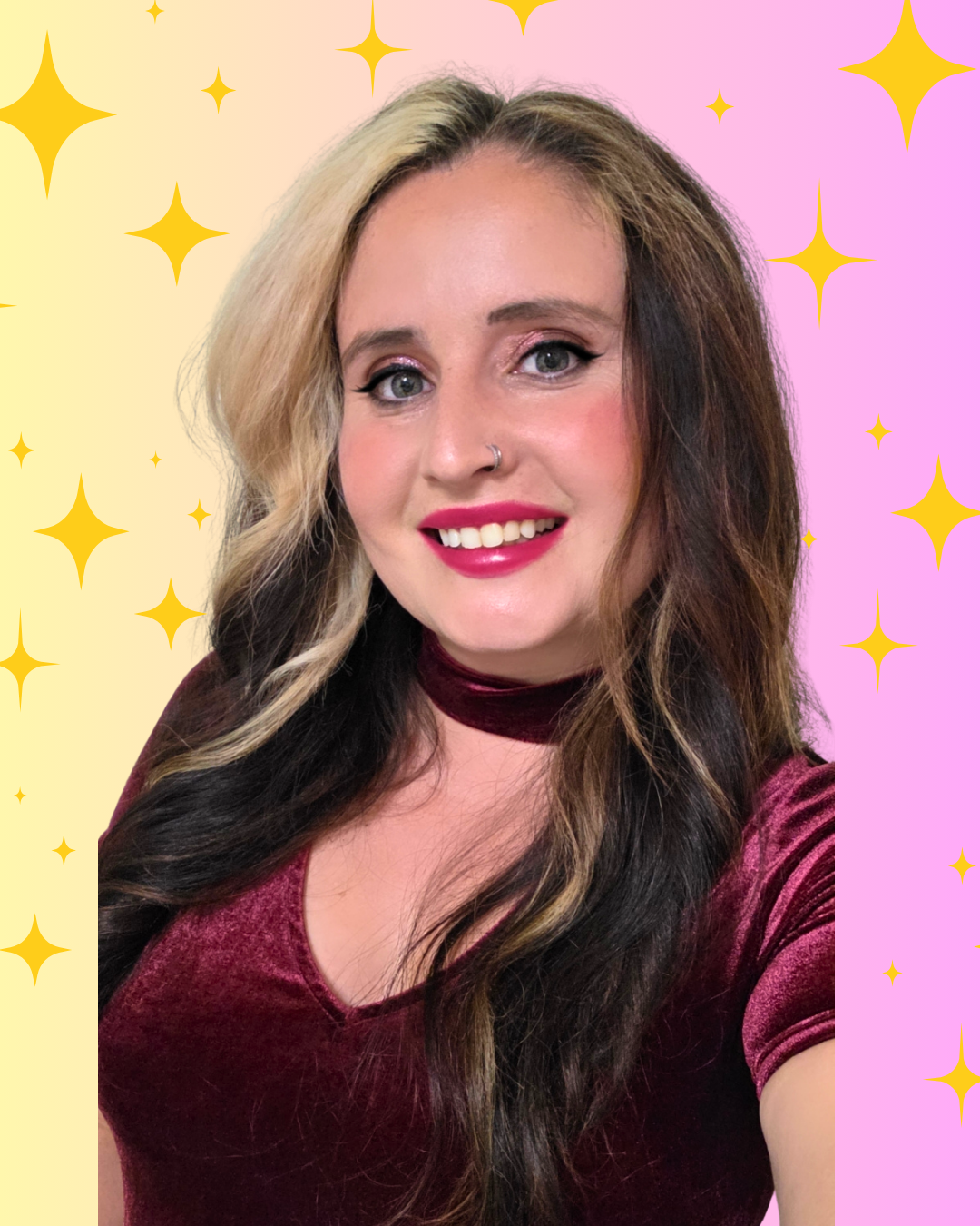 A woman with long, wavy, two-tone hair, wearing a velvet burgundy top and choker, smiling with bright makeup, against a pink and yellow starry background.