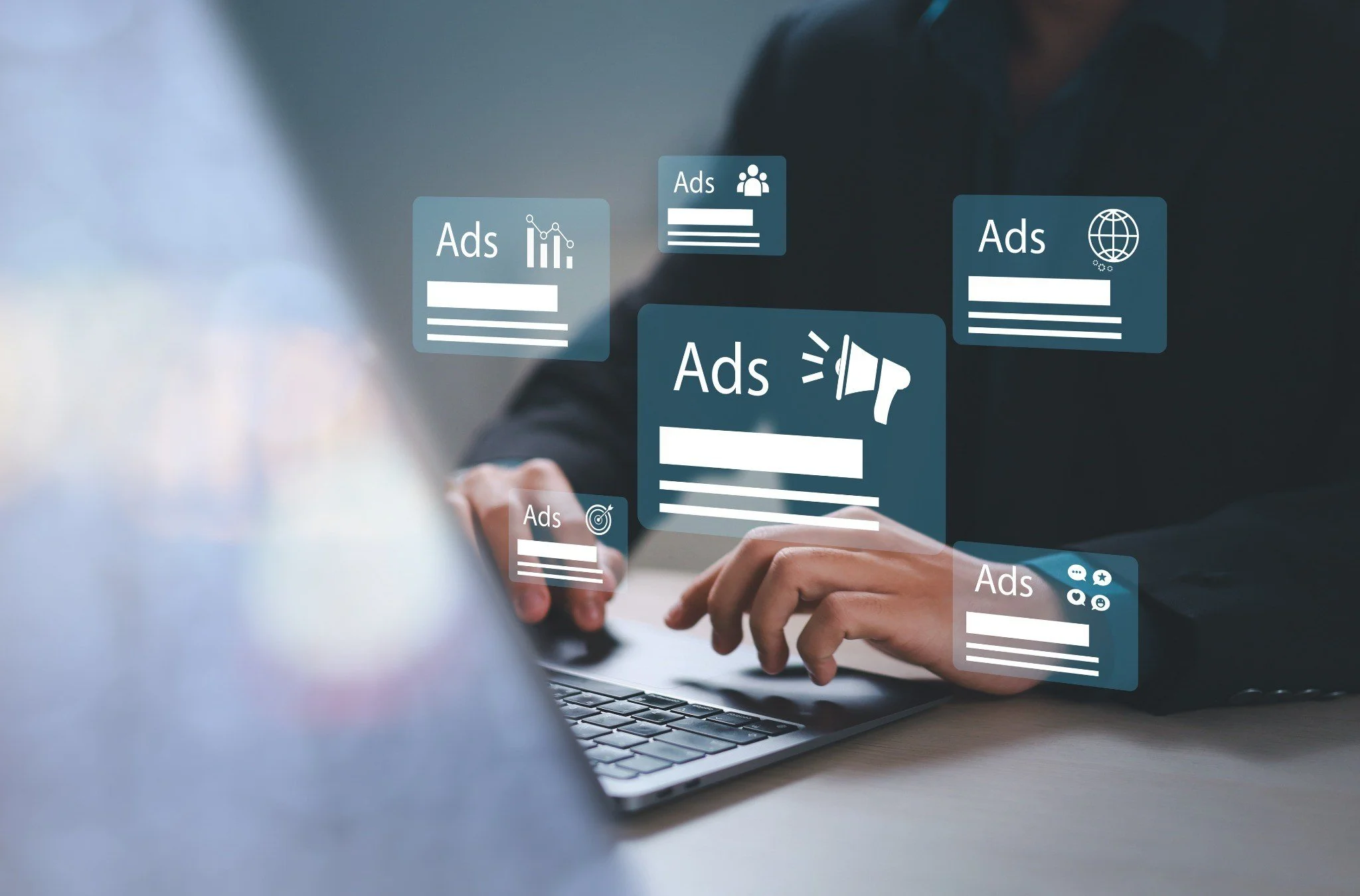 Person using a laptop with floating digital ads and icons for graphs, globe, target, and chat bubbles.