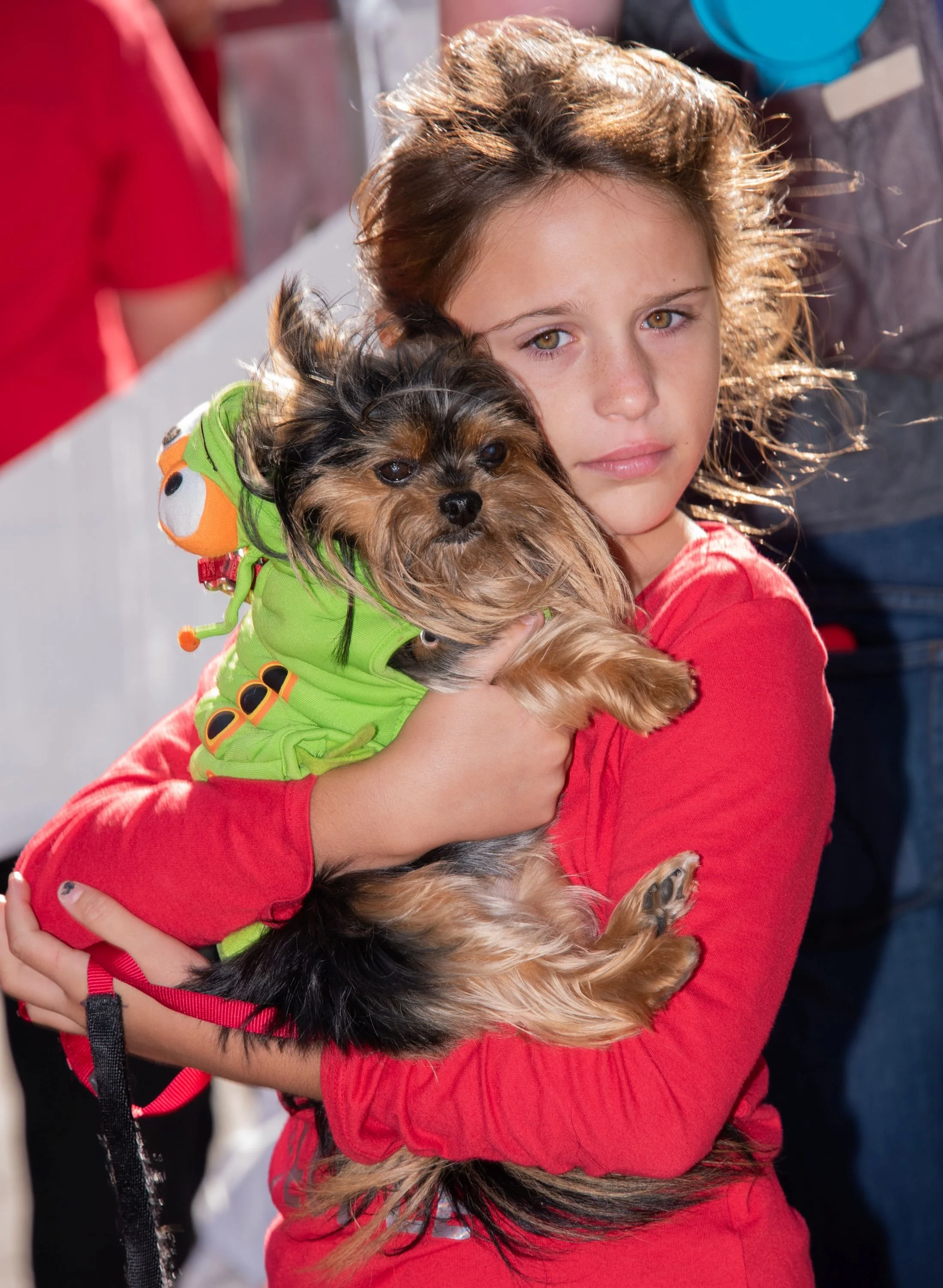 Girl hugging dog_by Susan Munroe.jpg