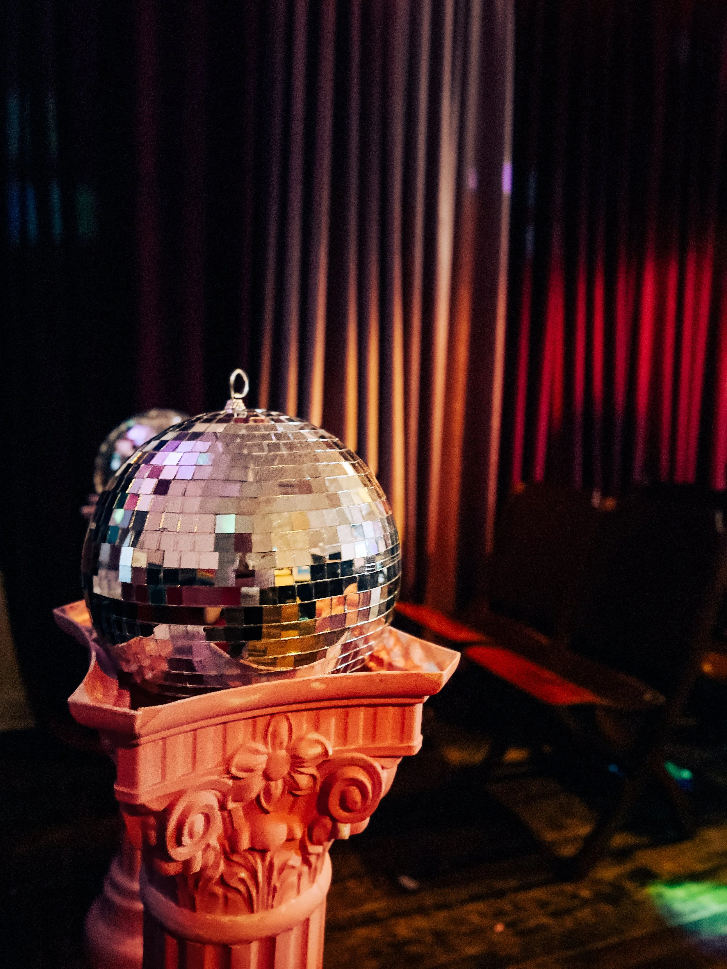 Disco ball lounge decor at The Neon Chapel, a Prince Edward County wedding venue