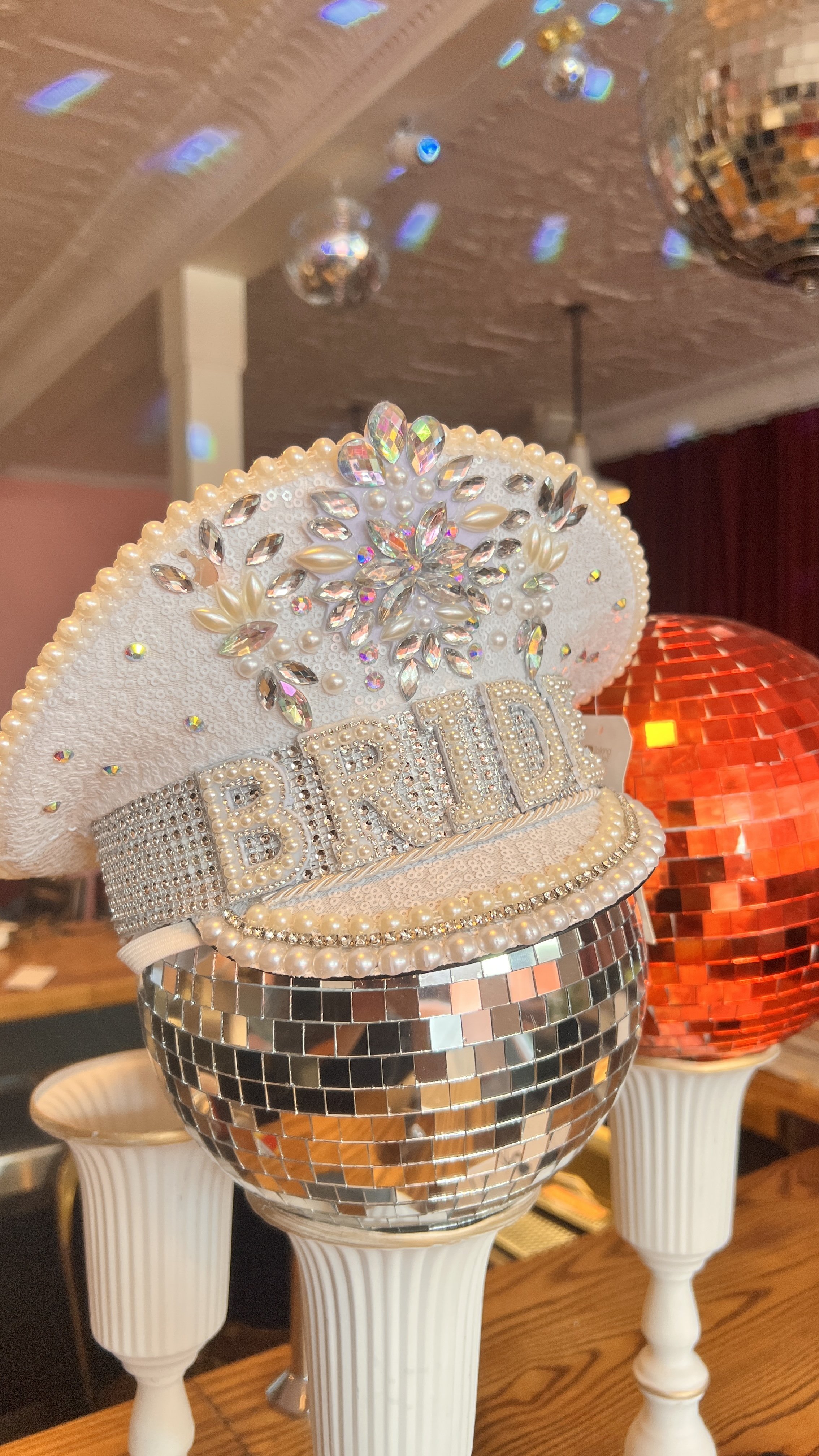 Rhinestone 'BRIDE' tiaras displayed at The Neon Chapel, a Prince Edward County wedding chapel.