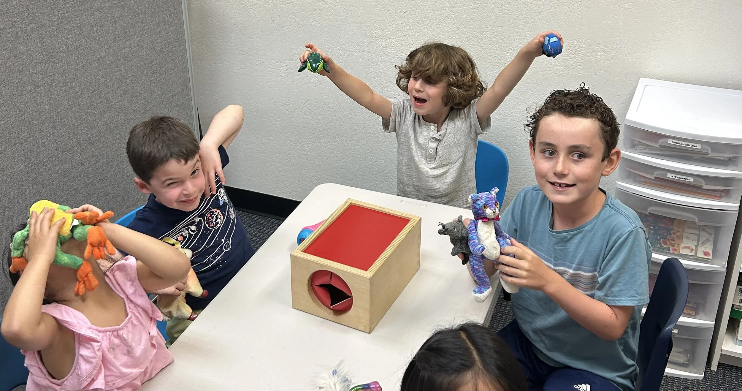 Children in social skills groups working on emotional regulation and impulse control at Friendship Builders