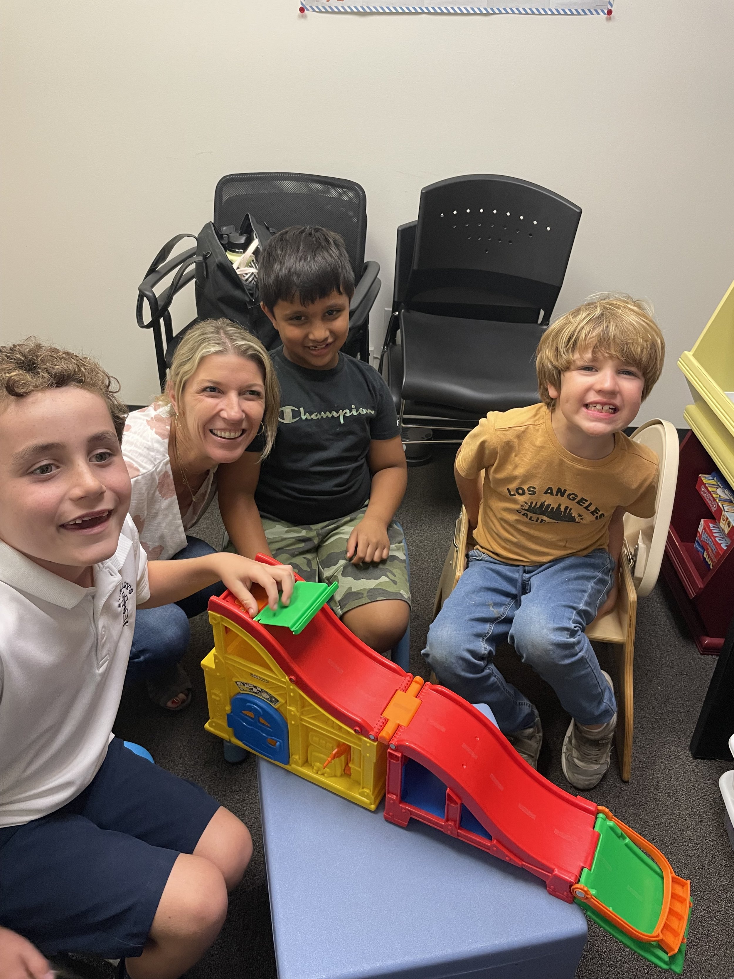 Four boys laughing and making friendships in social skills a group