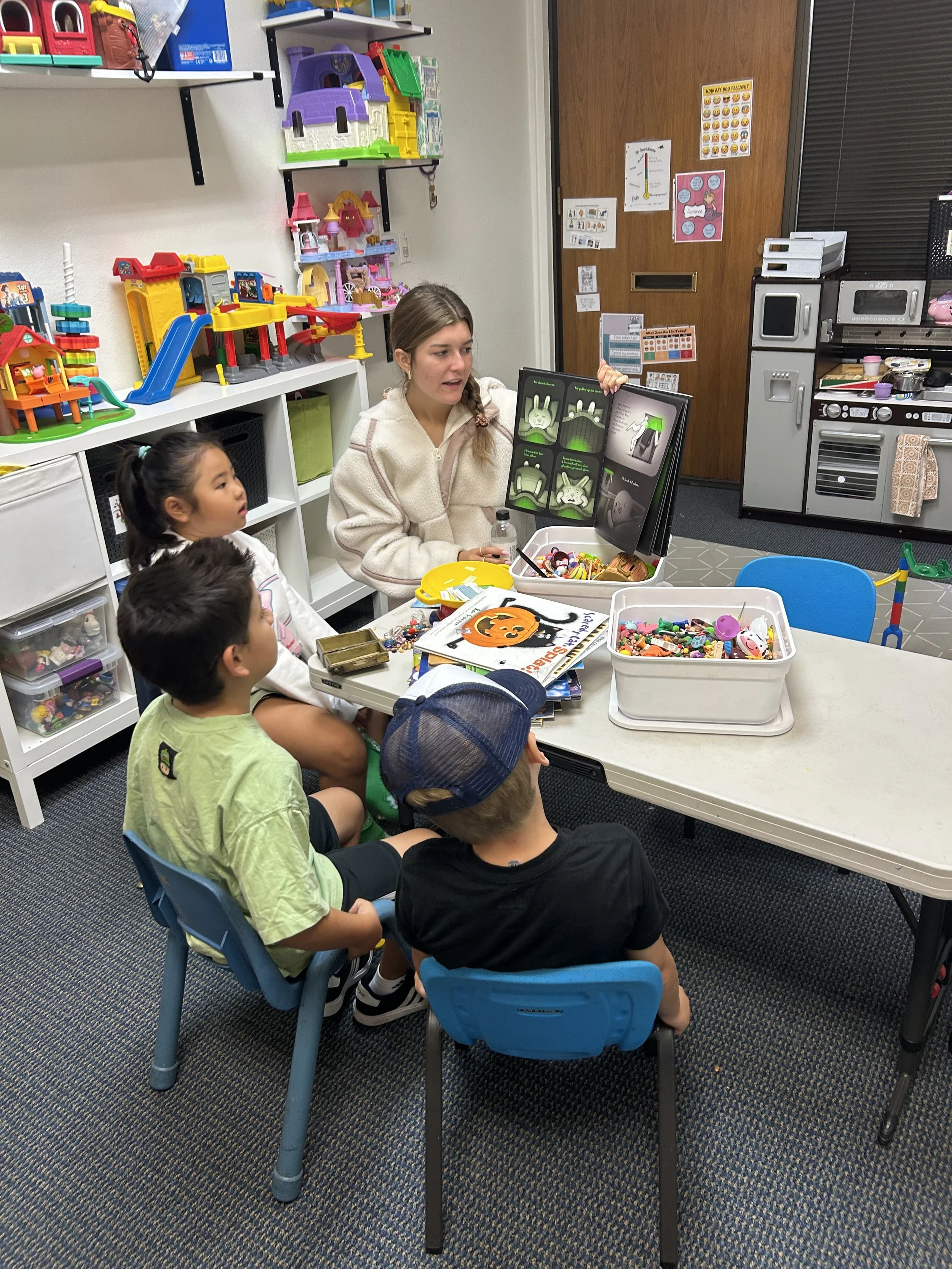 Children reading a book about impulse control and frustration tolerance