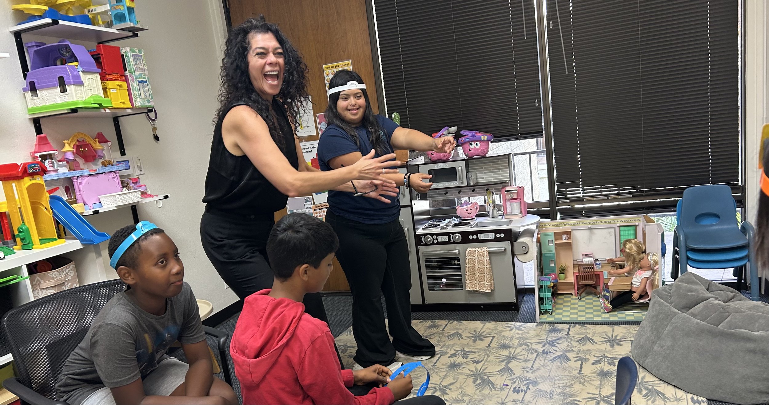Teens playing charades in a social skills group working on perspective taking