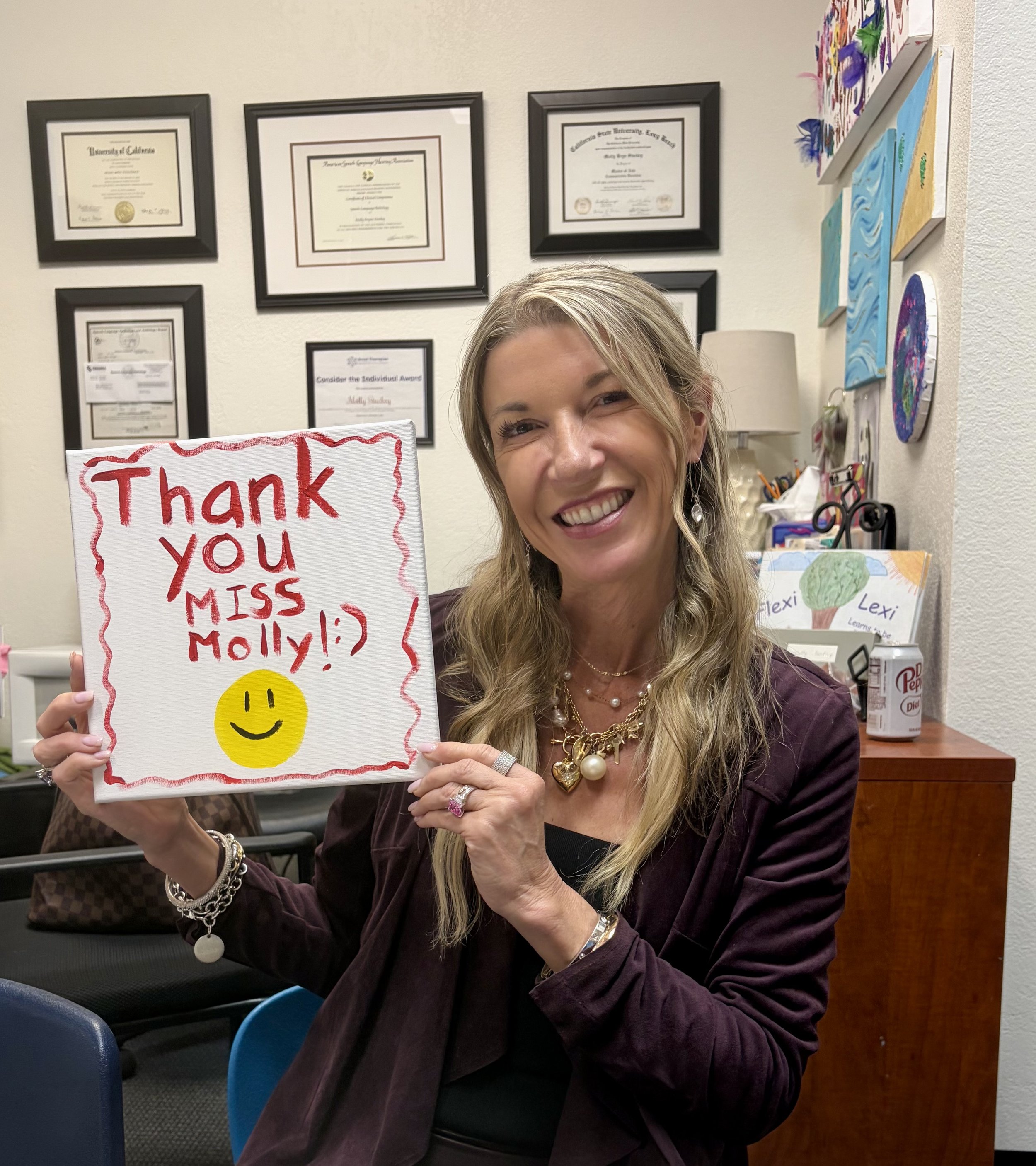Friendship Builders owner Showing thank you sign from a teen in social skills