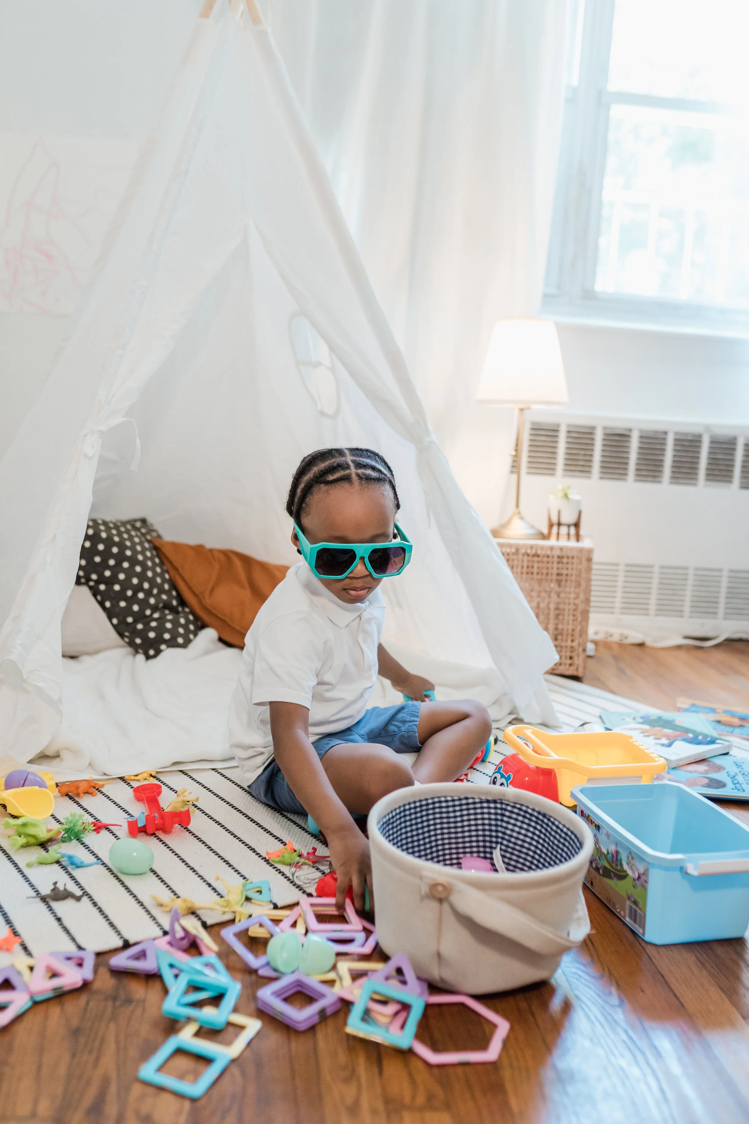 Toddler with sensory supports playing during speech therapy in Littleton Colorado