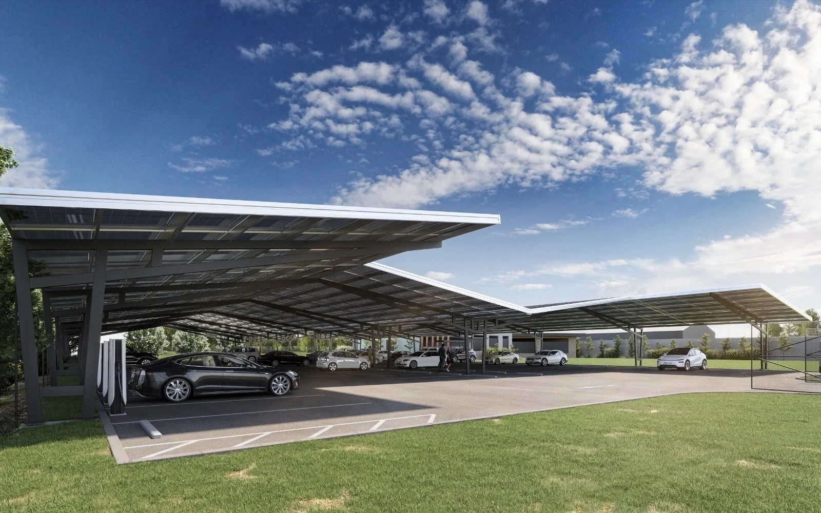 Grand Canyon Series Solar Canopy. A full portal-frame structure that covers every parking bay AND the driving lanes between them. Nothing in the car park is exposed. Maximum solar density, premium amenity, single visible roof.