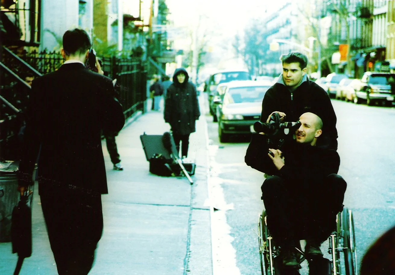 Independent filmmakers with wheelchair dolly producing 90s NYC indie movie 'Threat'.
