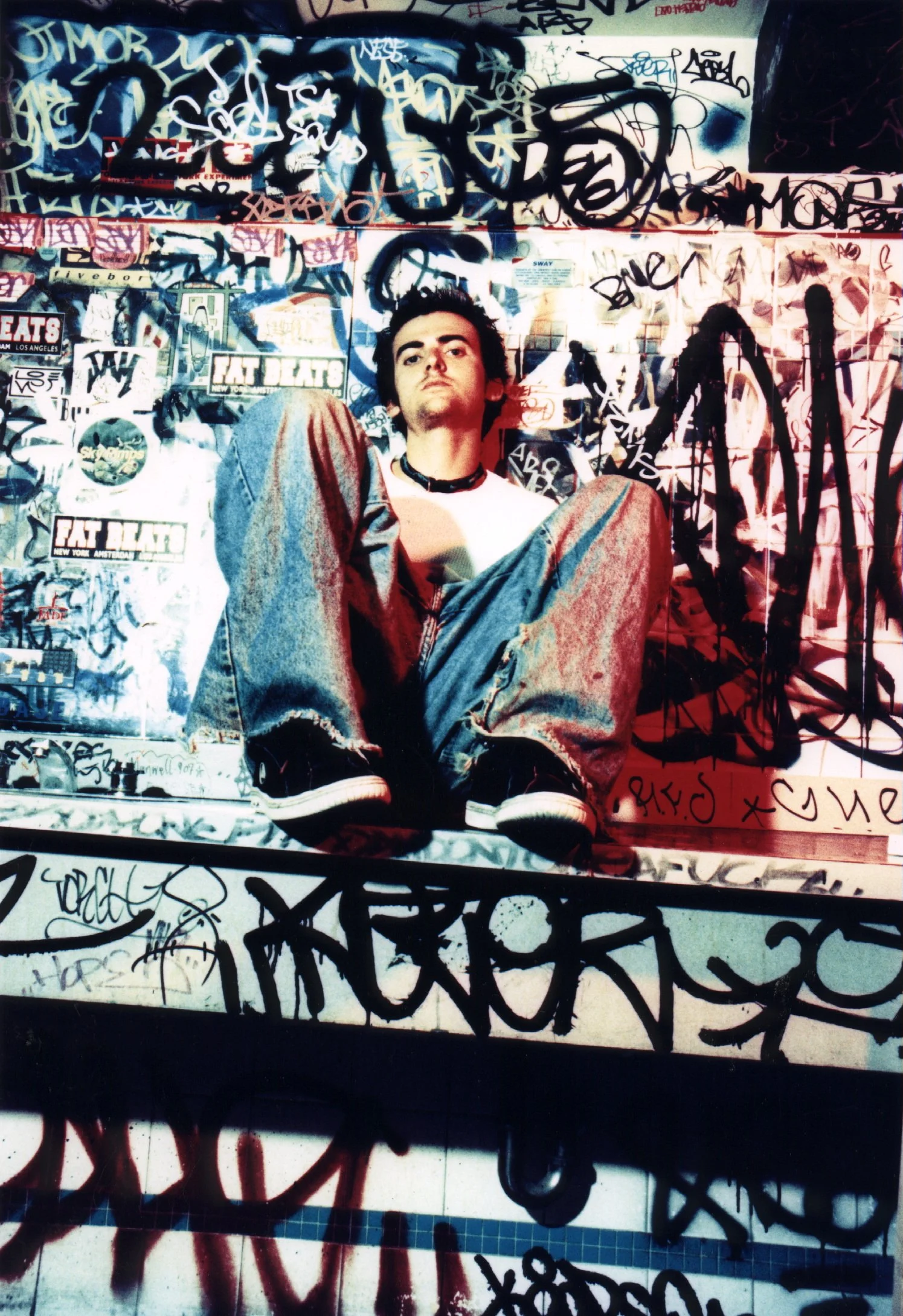 Punk film actor in independent movie 'Threat' on location in 1990s graffiti covered East Village bathroom, directed by Matt Pizzolo produced by Katie Nisa NYU Tisch indie film school