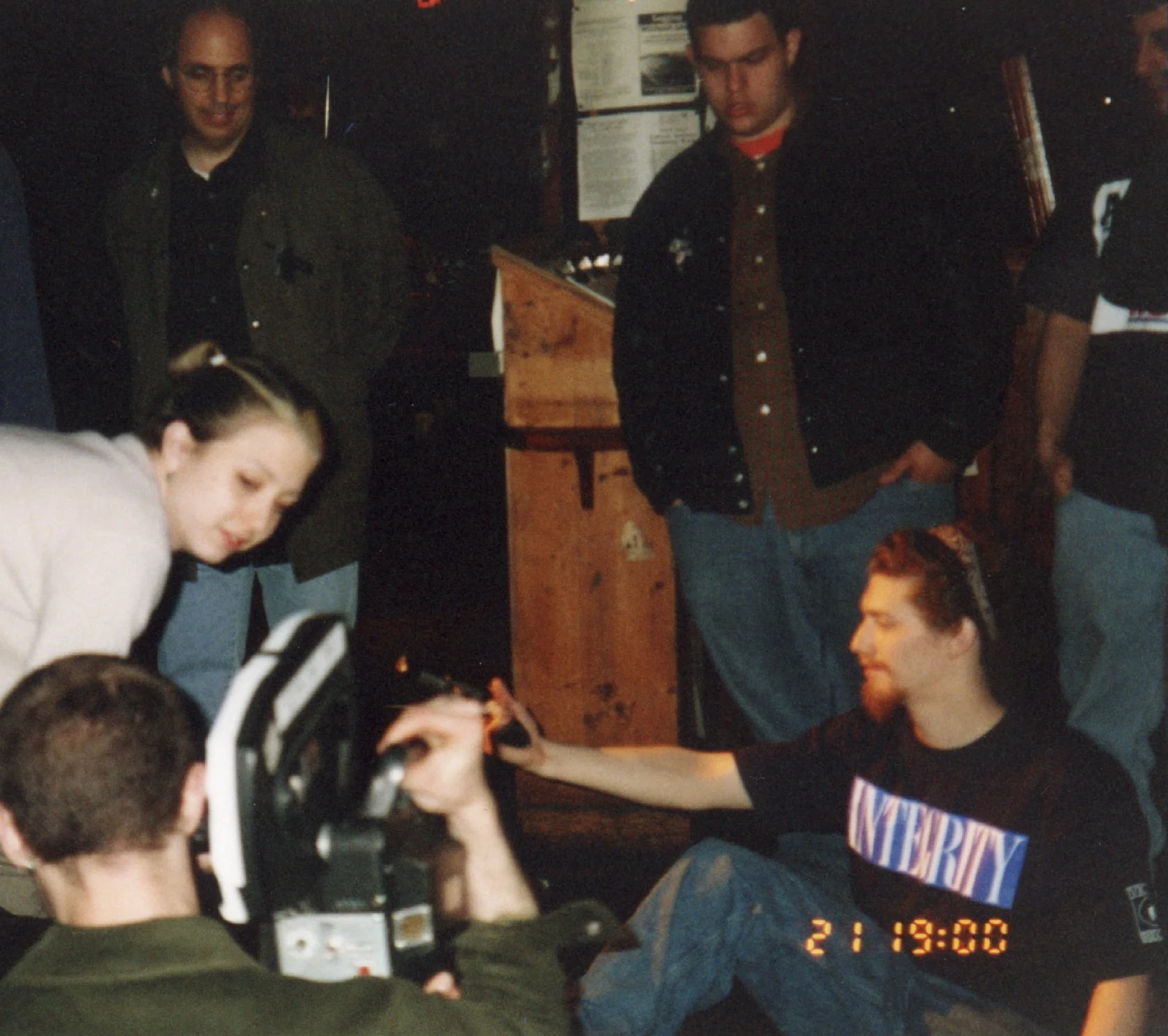 Independent filmmaking team and punk singer preparing a gunshot scene in front of a 16mm camera in 1997 NYC for the indie movie 'Threat'.