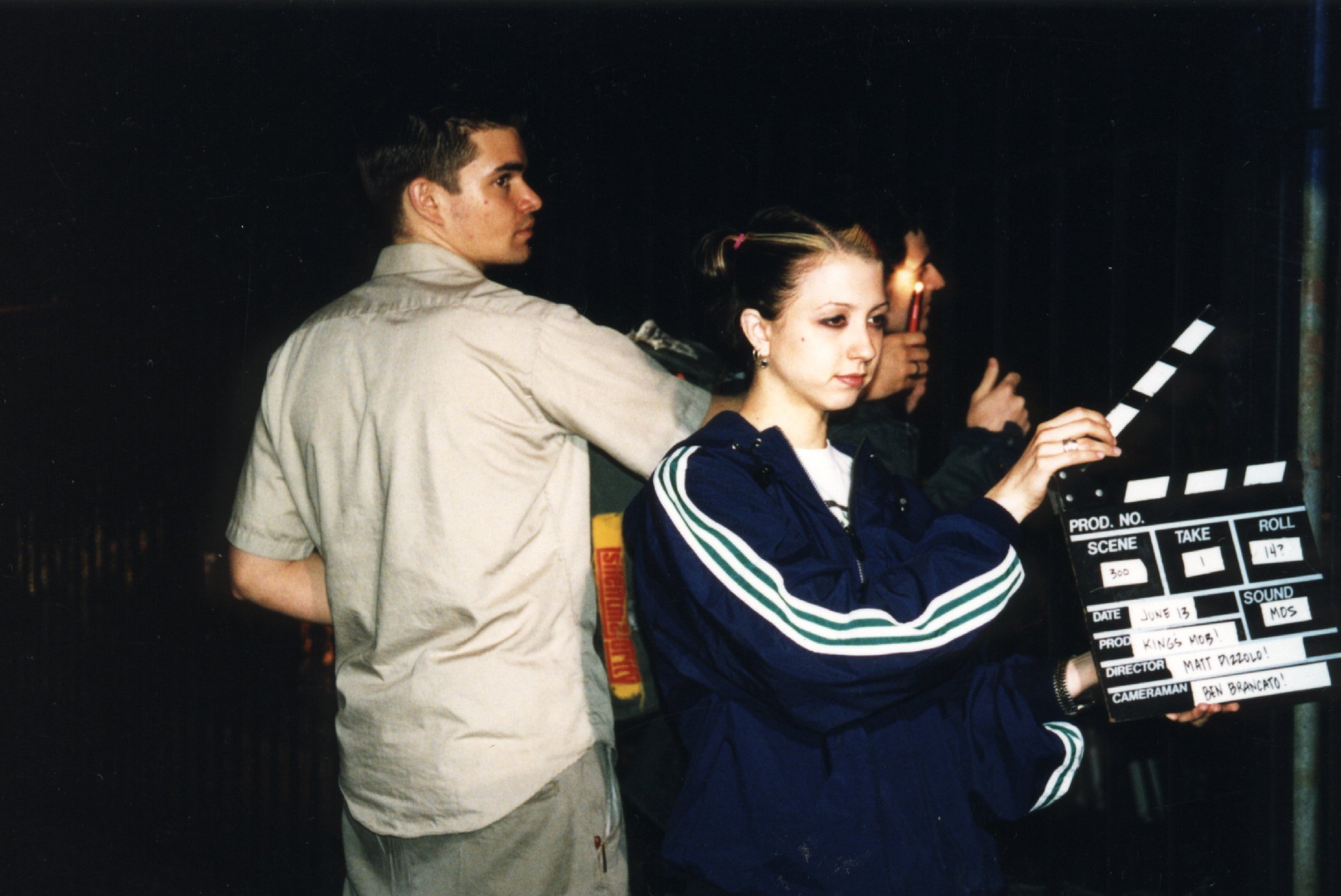Independent filmmakers with slate on set of NYC 90s indie movie 'Threat'.