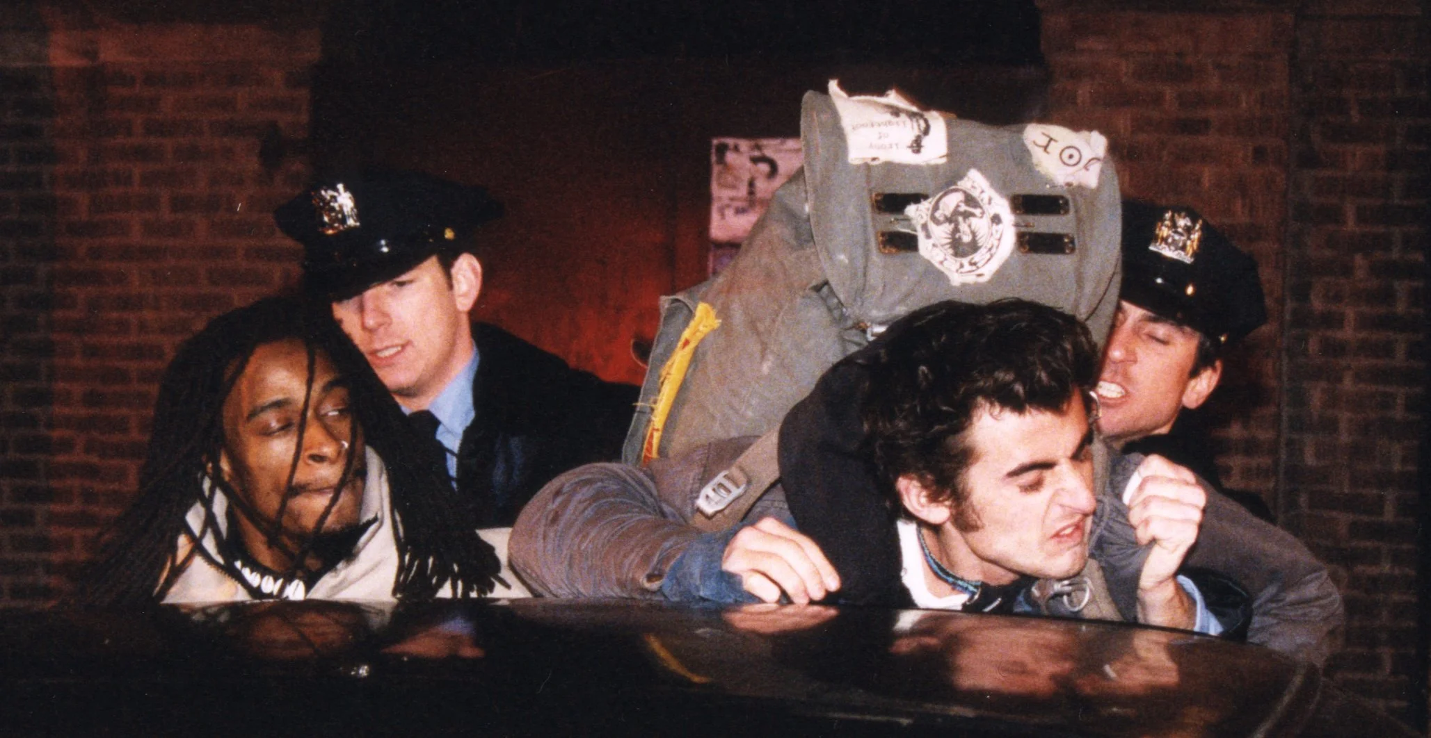 A rapper and a punk are accosted by NYPD police in indie movie 'Threat'.