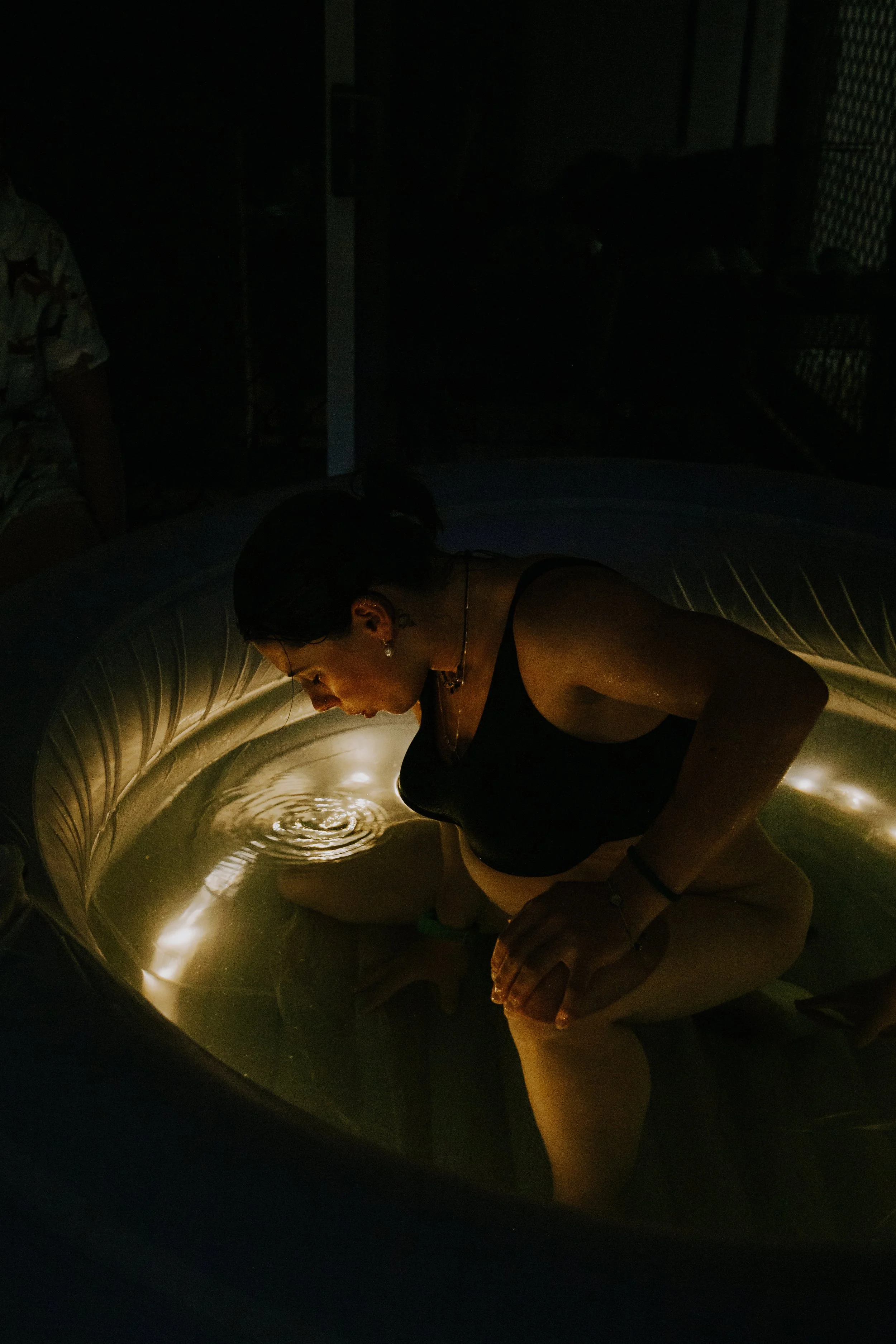 A woman focused on the power of her breathing through birth, one contraction at a time.
