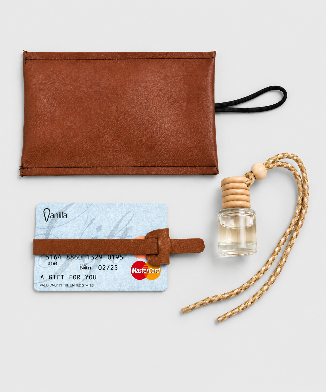 A brown leather glasses pouch, a card with a leather strap, a small glass bottle with clear liquid and a cork stopper, and a twisted beige and white rope with a wooden bead.