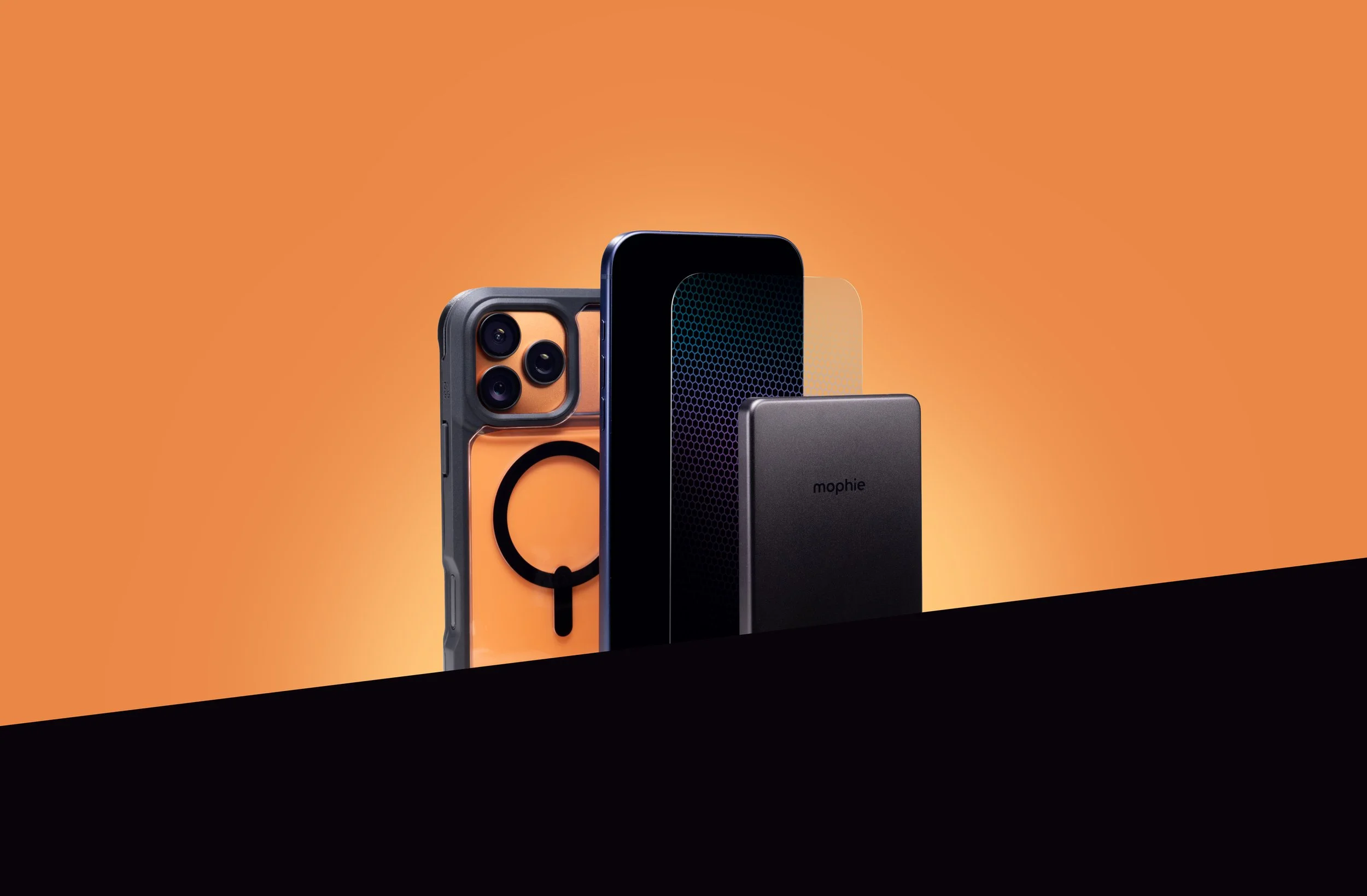 Display of various smartphone models against an orange background