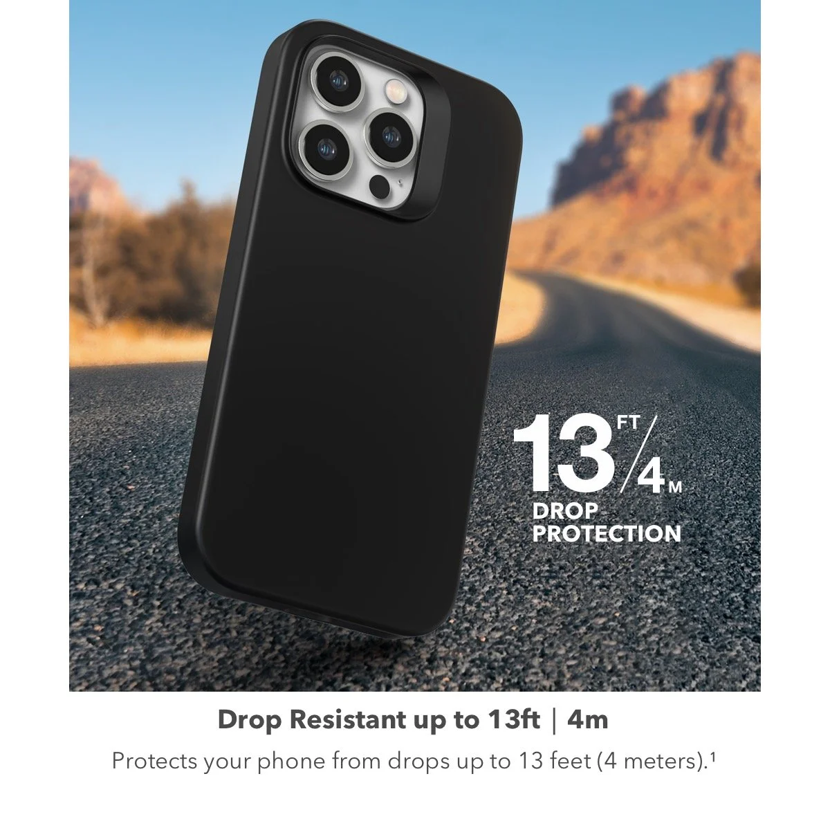 A black phone case designed for drop protection, shown outdoors on a gravel road with mountains in the background. Text indicates it is drop resistant up to 13 feet (4 meters).