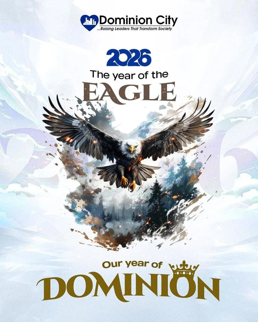 A promotional graphic for Dominion City displaying a bald eagle with wings spread wide soaring above a forest, with a background of a light-colored sky. The text says "2026 The year of the Eagle" and "Our year of Dominion".