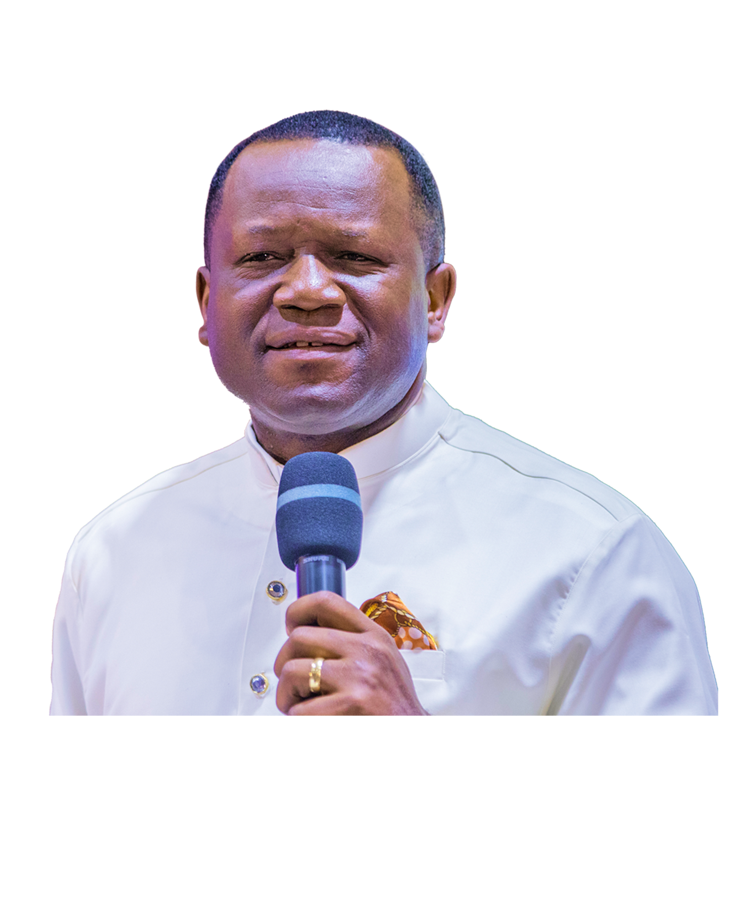 Close-up of a man in traditional attire holding a microphone.