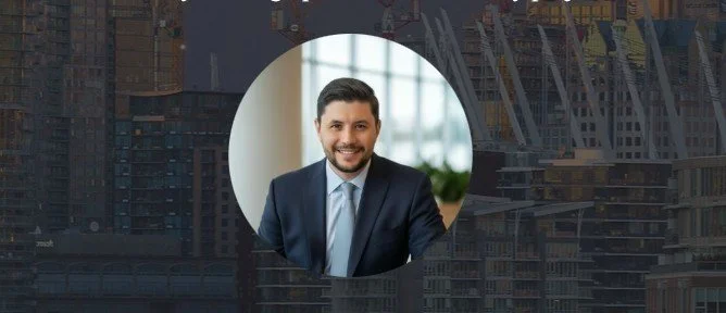 Portrait of a smiling man in a business suit sitting in an office