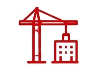 Red construction crane lifting a building component