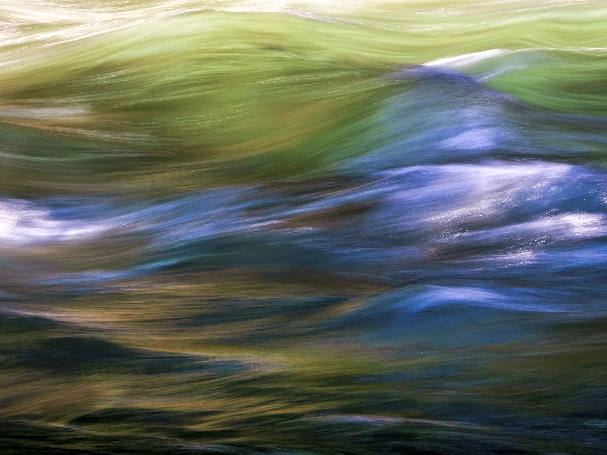 The image is almost purely horizontal in its energy — everything streams left to right, or right to left depending on where your eye enters. There's a gentle diagonal structure: the warm greens in the upper left, the blue band cutting across the midd