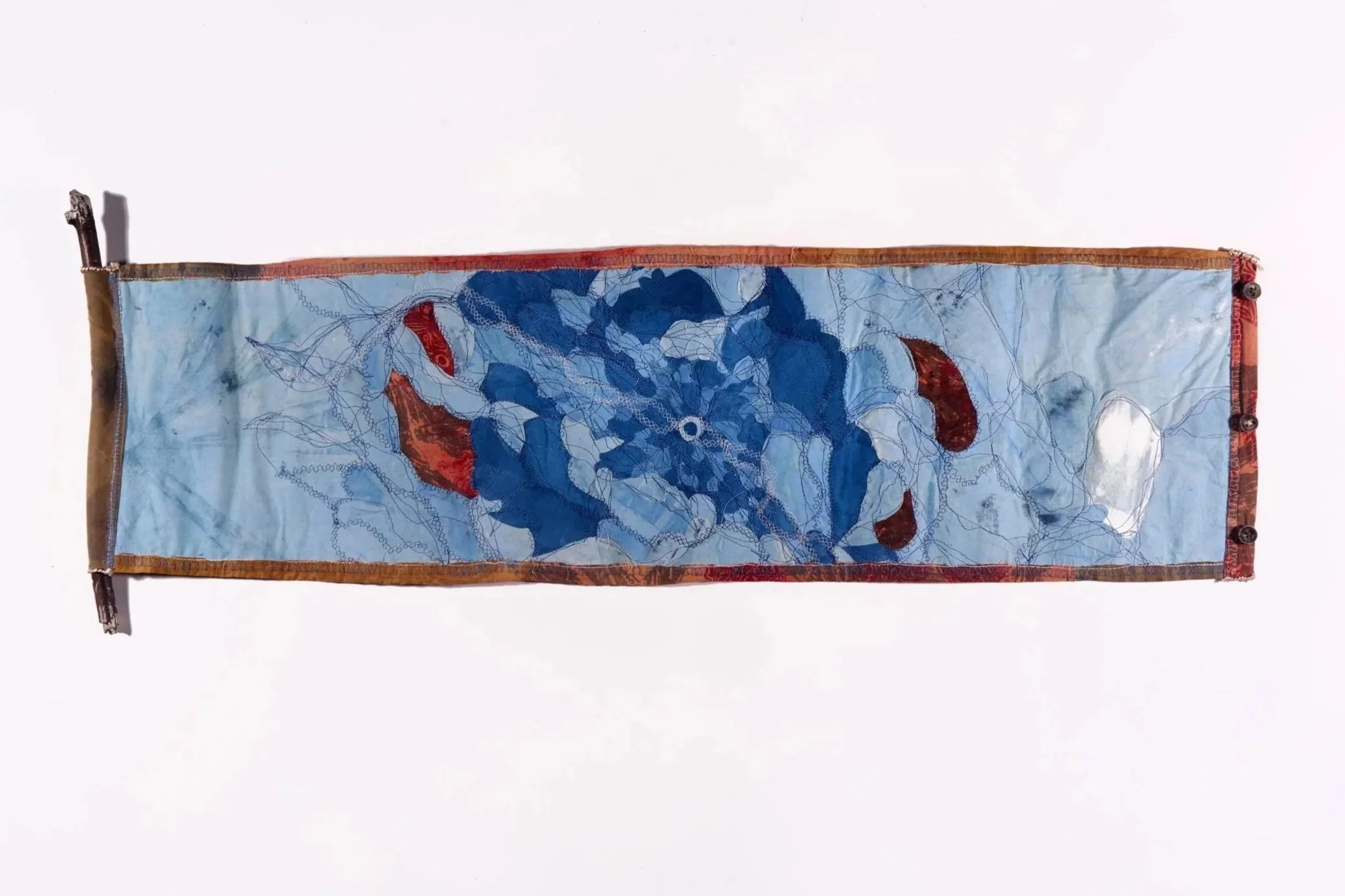 From our Depths, 2025 | Naturally-dyed cloth, thread, found driftwood, buttons