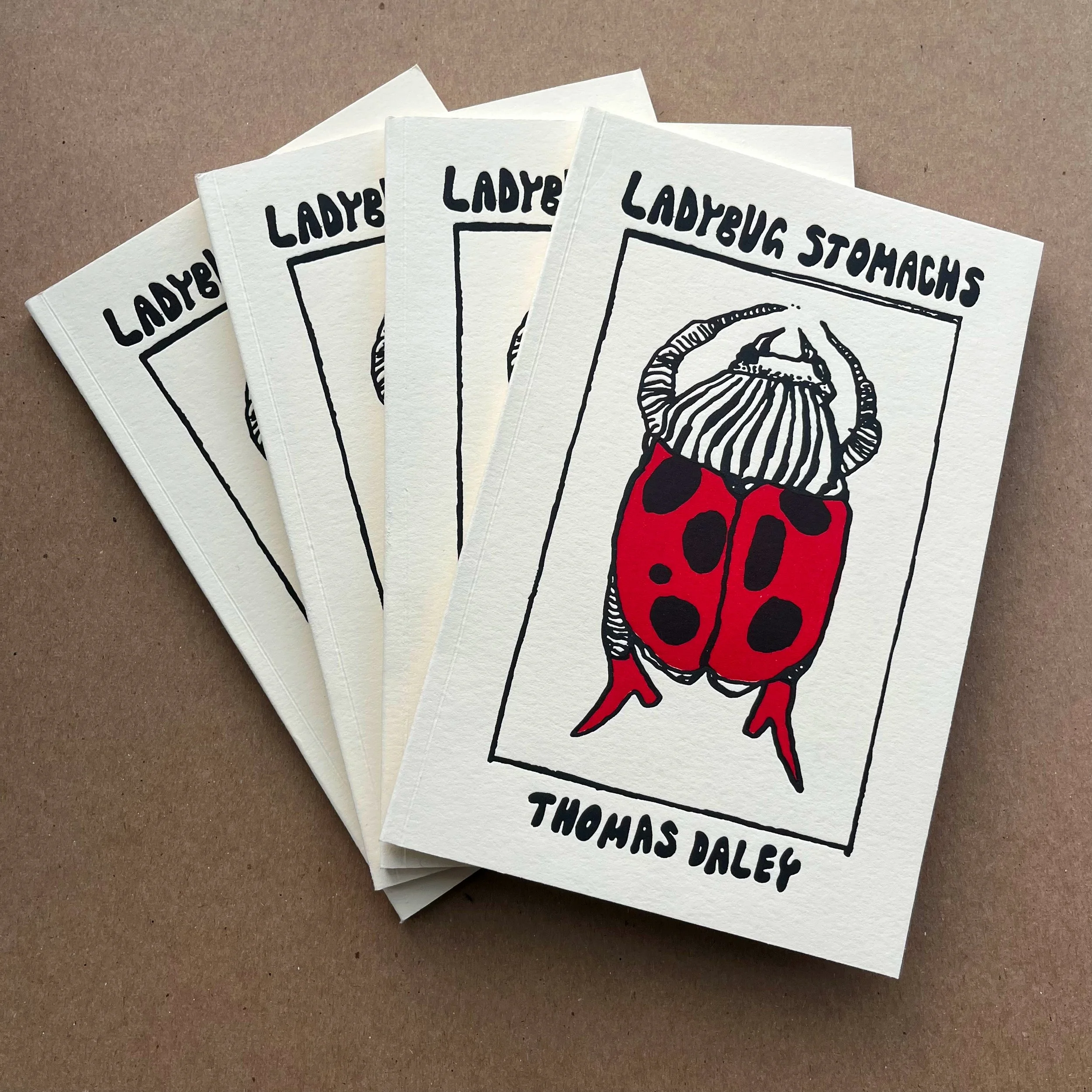 Ladybug Stomachs, 2024 | Poetry Collection written by Thomas Daley. Covers letterpress printed at San Francisco Center for the Book and bound by Zoe Spikerman