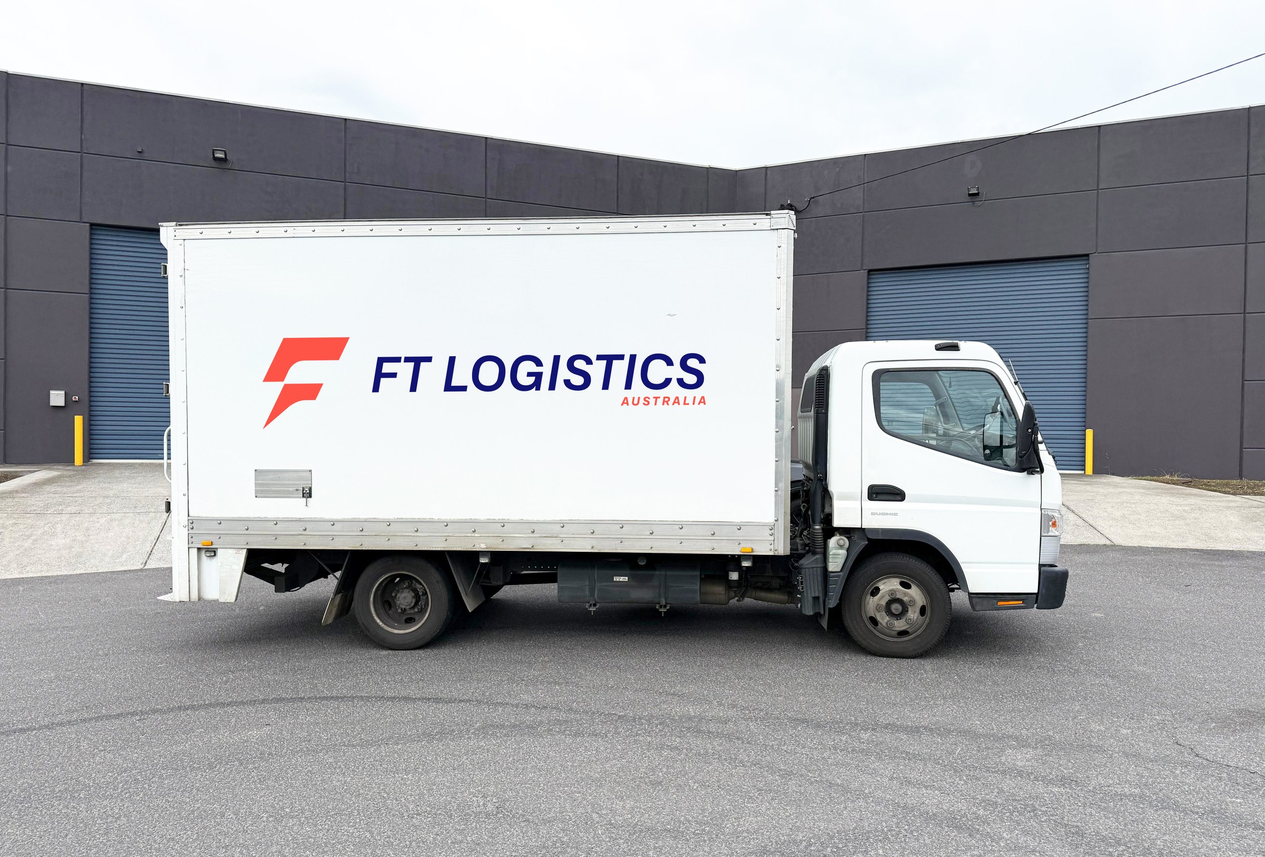 FT Logistics Australia brand identity featuring a refined logo, cohesive visual system and premium branding for a modern transport and supply chain business