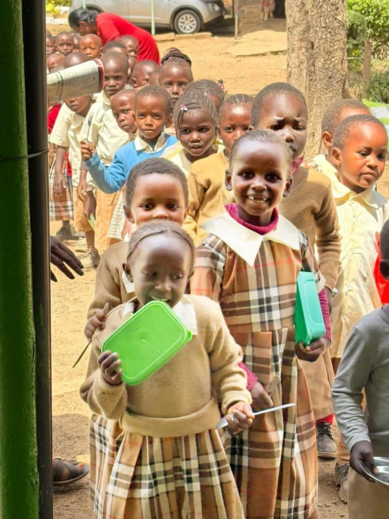Children queuing for lunch in Kenya