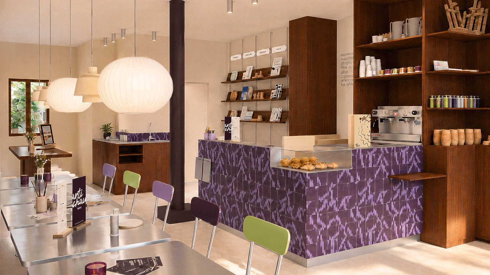 Vue intérieure du comptoir, des tables en inox et du mobilier du café Artichaut