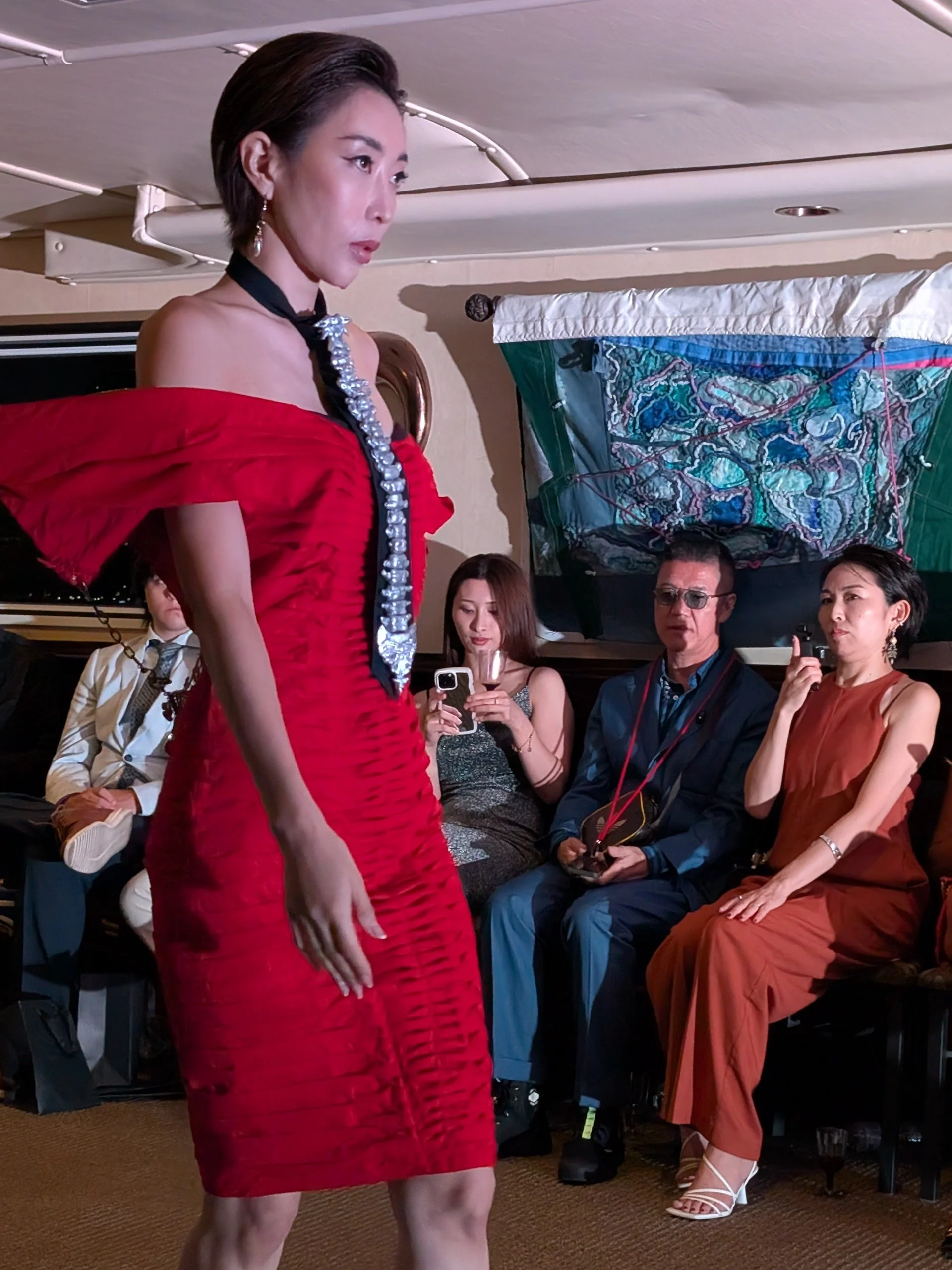 fashion model on boat in New York, featuring hand made Textile Art by Lucinda Button