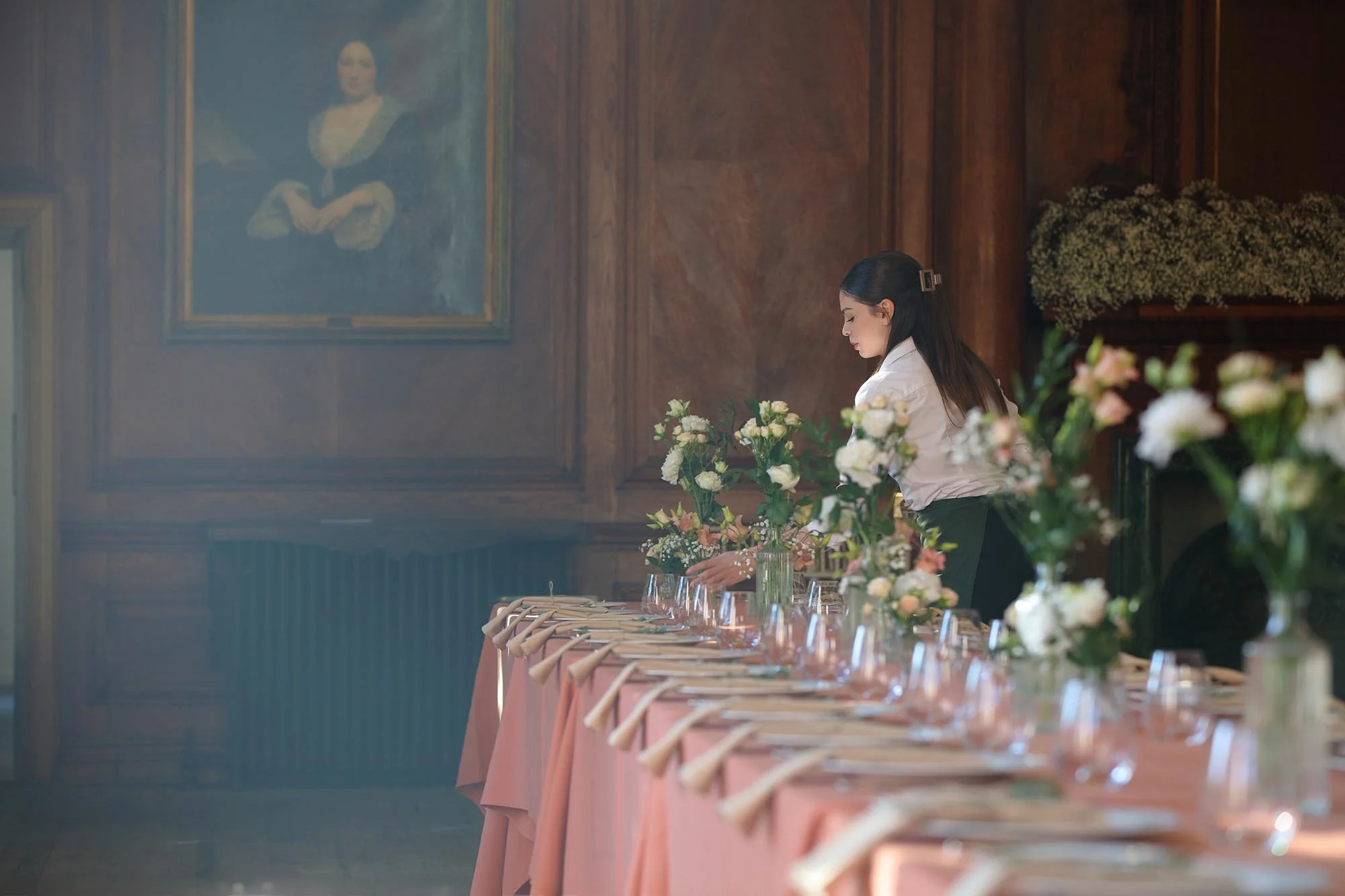 Final wedding day table adjustments by Raquel's staffing and bar service