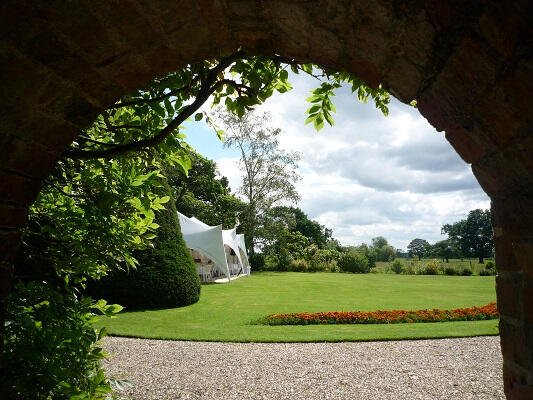 Wedding marquee seen through arch