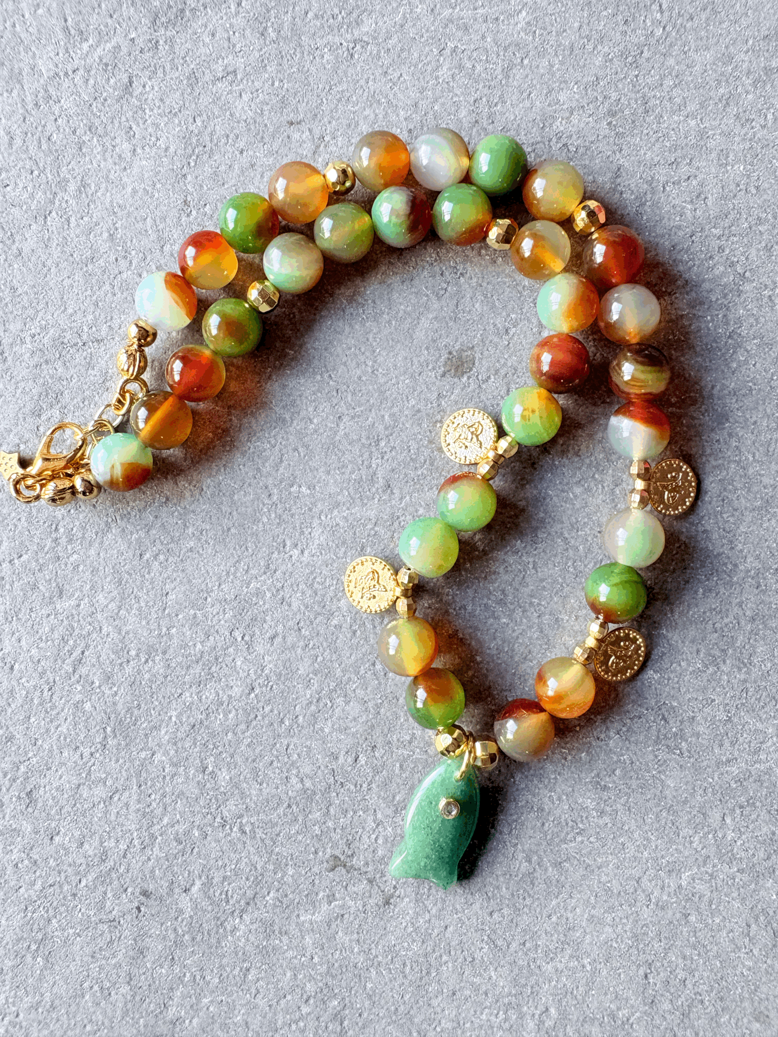 Peacock Agate bead necklace with fish pendant.