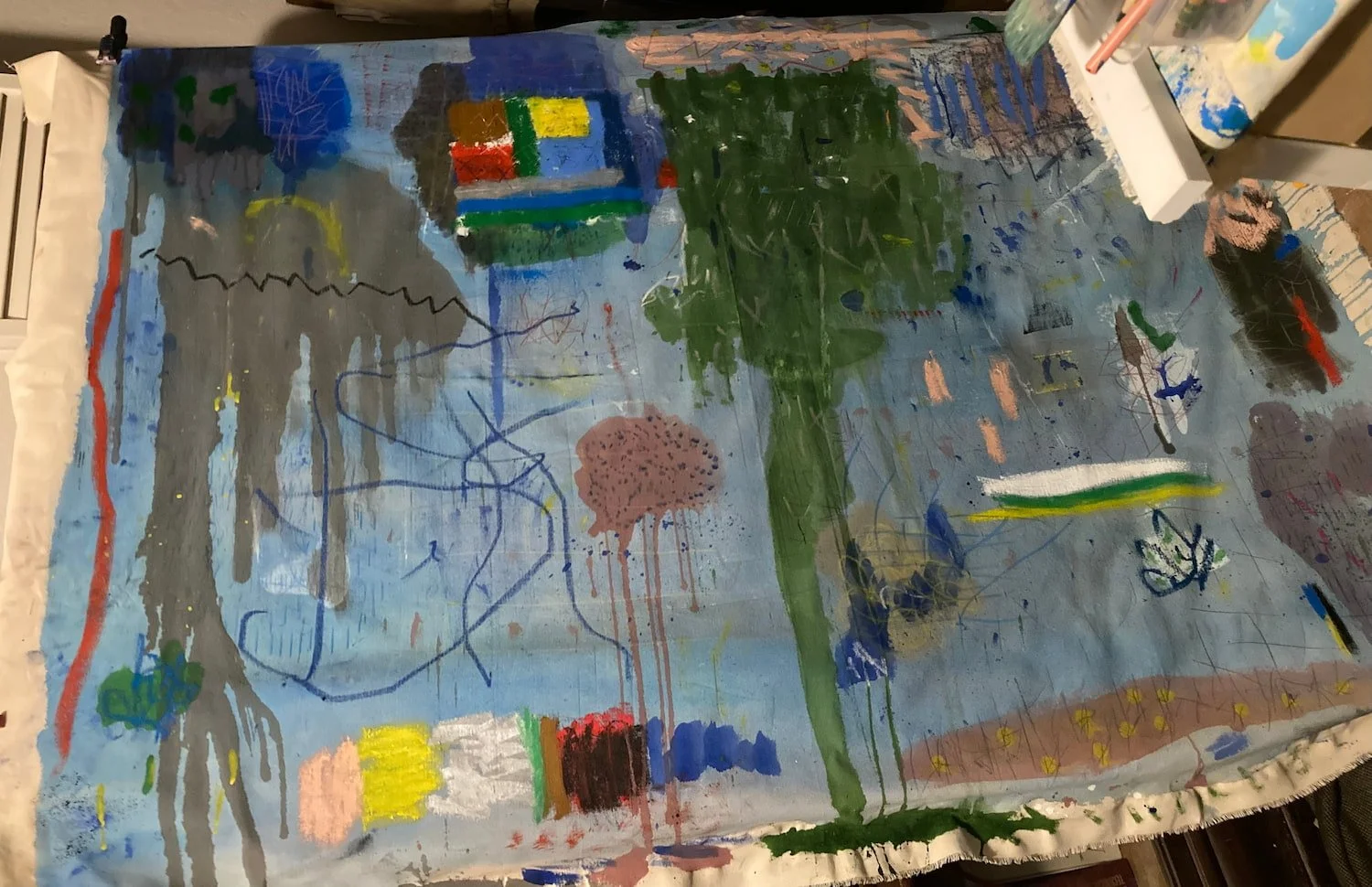 Large abstract painting in progress by Marcus Bacher showing gestural marks and layered color on blue ground