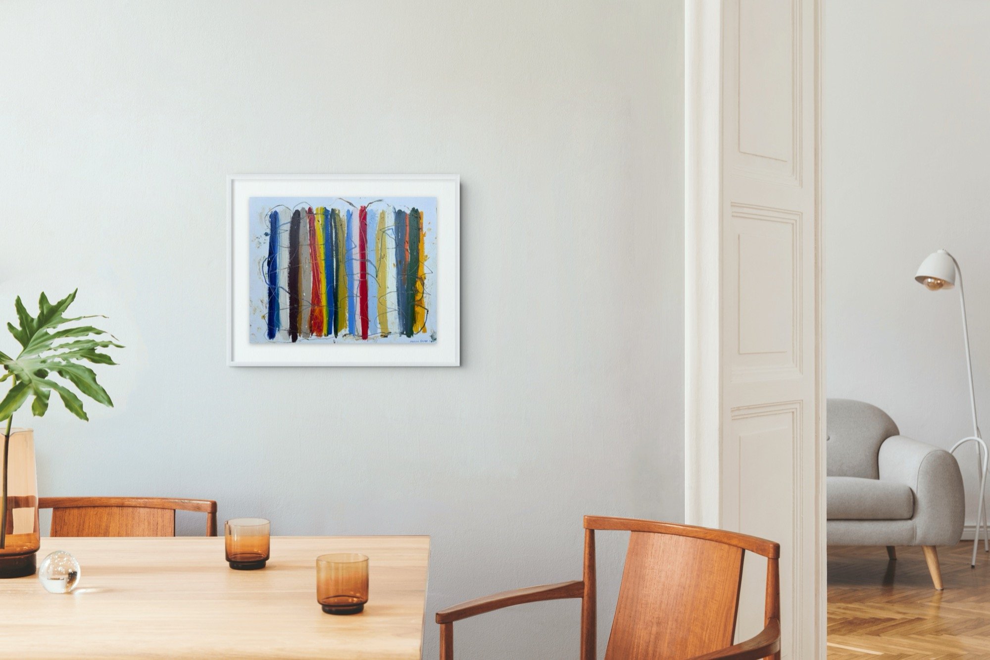Shoreline Stripes II, 20x24 framed original abstract painting in oil sticks and markers on paper by Marcus Bacher, framed on a gray wall above a mid-century dining table with teak chairs.