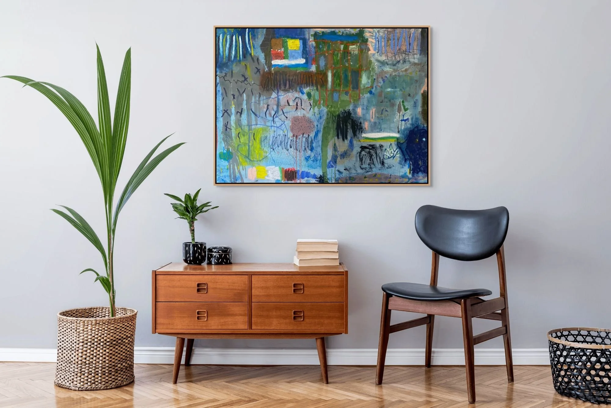 Chromantic Whirlwind original abstract painting by Marcus Bacher displayed in mid-century modern interior with teak credenza