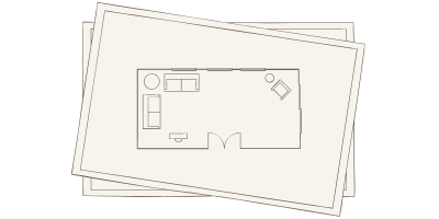 Simple floor plan showing a living room with a sofa, armchair, coffee table, and a small side table, with an entrance door at the bottom.