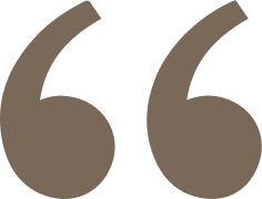 A large pair of beige quotation marks against a black background.