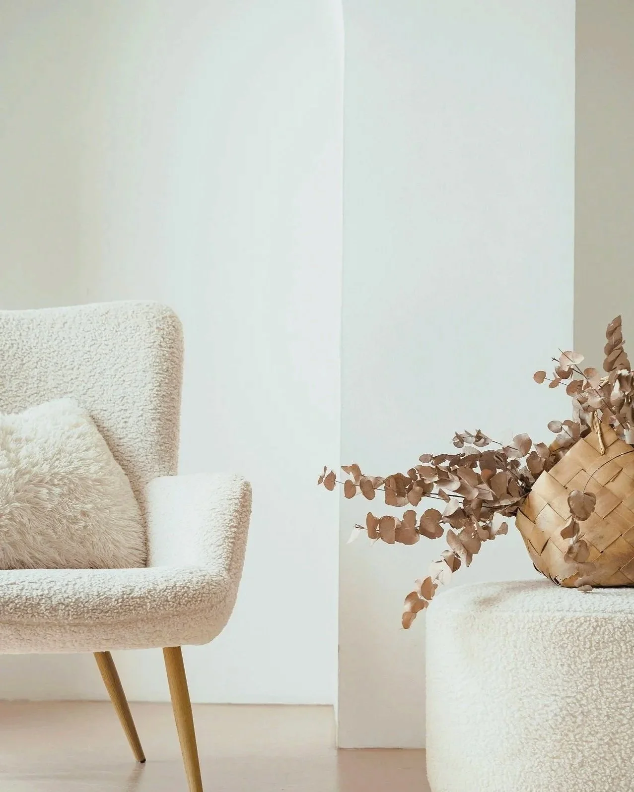 Calm neutral therapy space with armchair and soft furnishings.