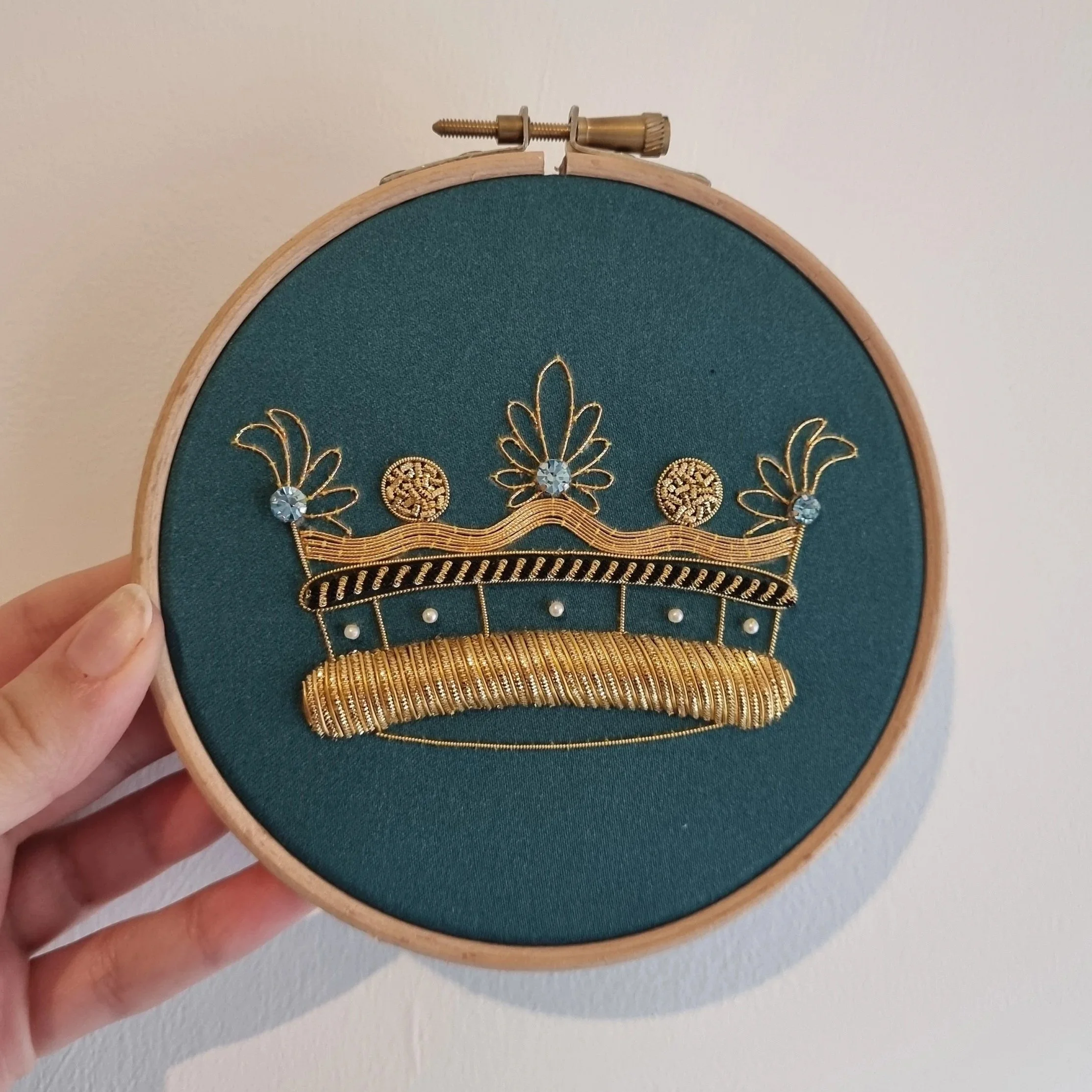 Crown worked at a Hand and Lock goldwork embroidery workshop.