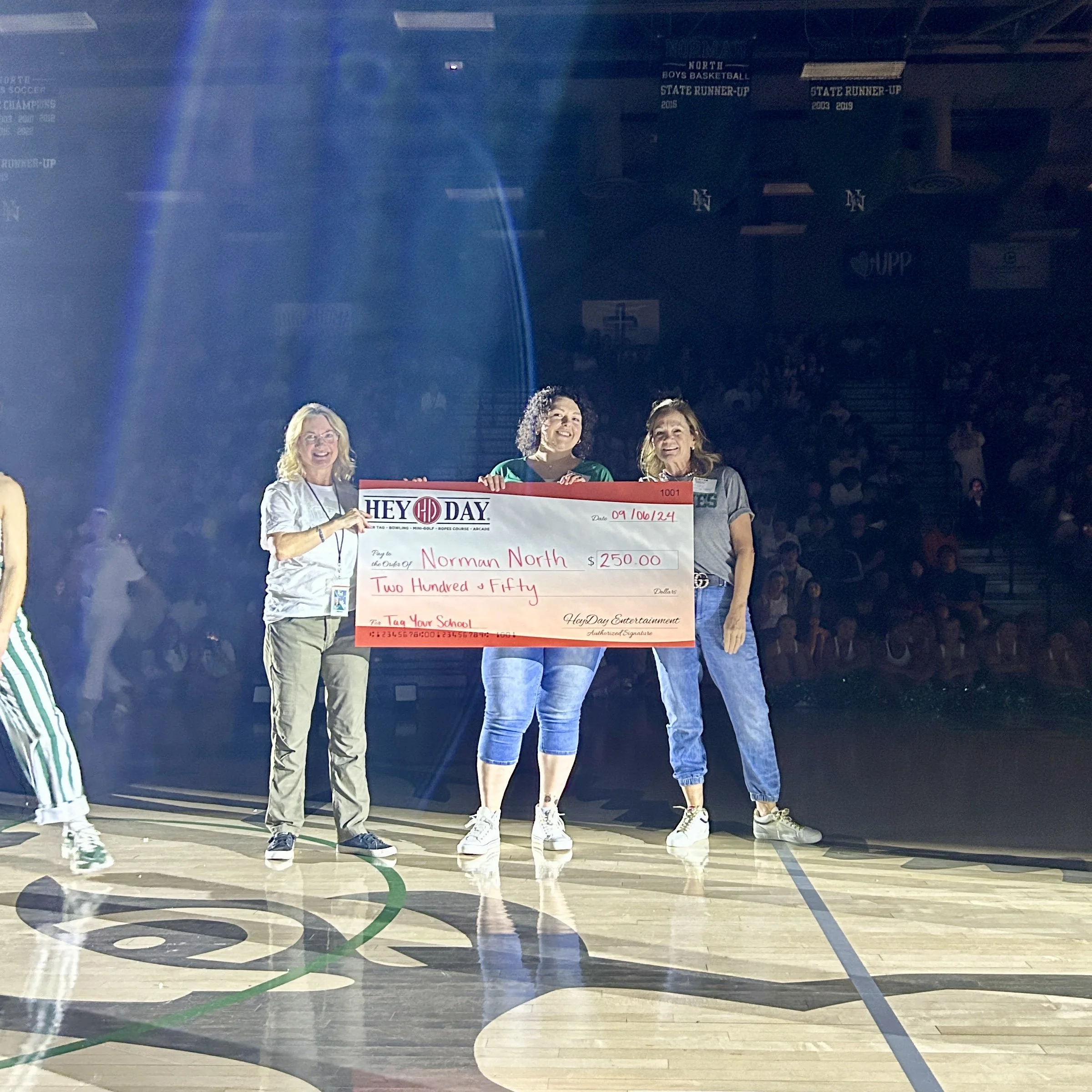 HeyDay presenting donation check to Norman North