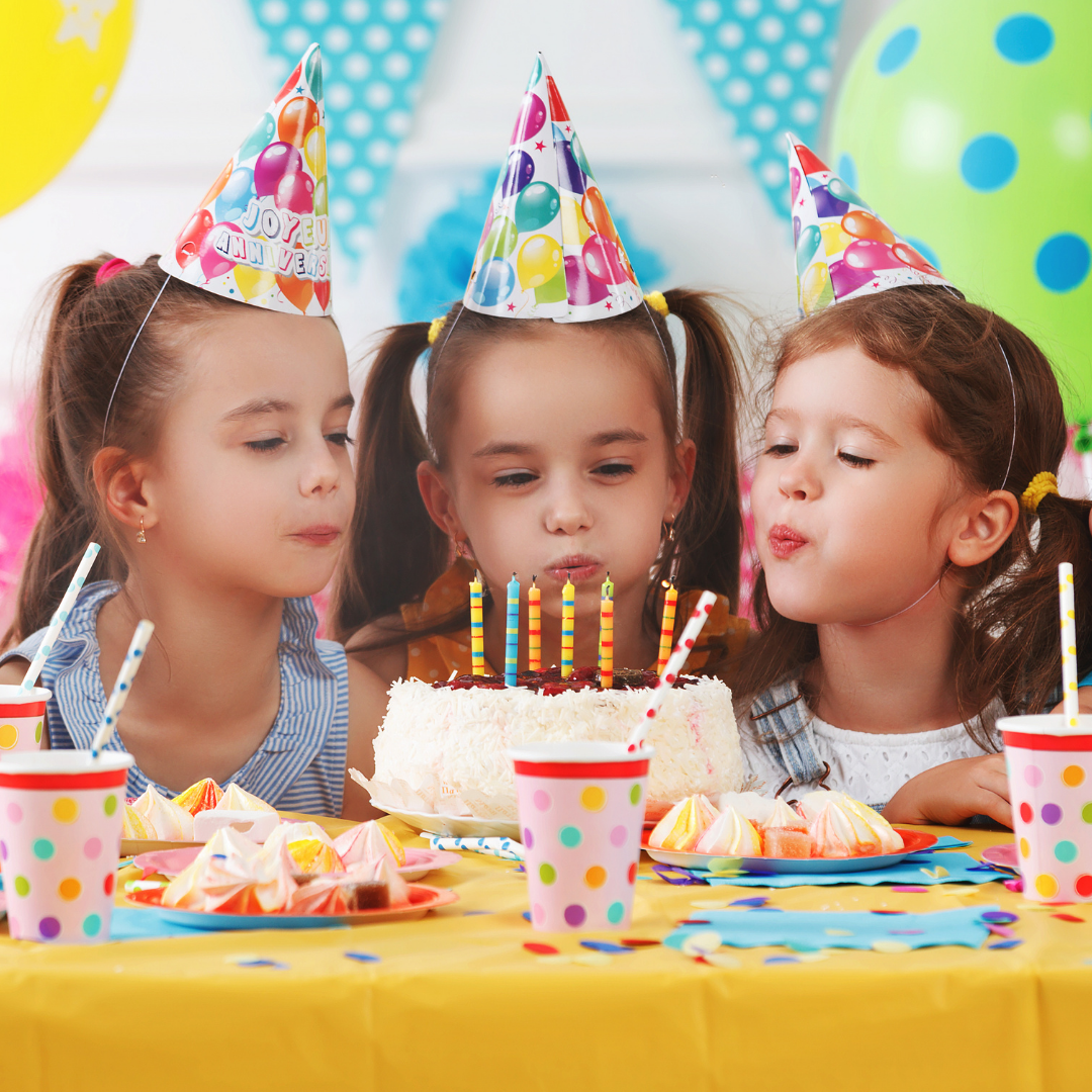 Blowing out birthday candles .