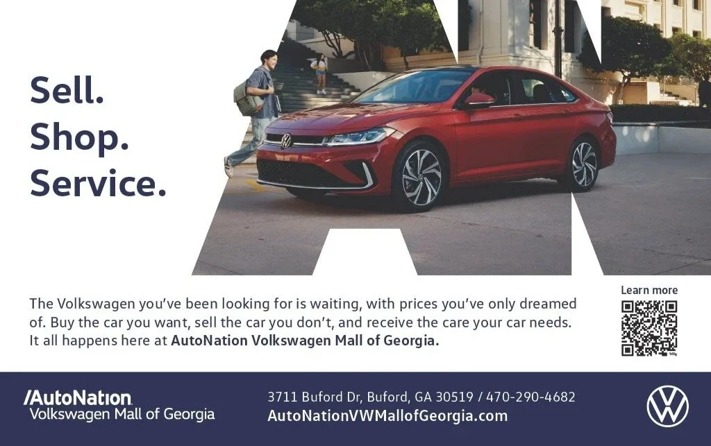 Red Volkswagen car parked in front of AutoNation Volkswagen Mall of Georgia with a man and children walking nearby, overlaid with large text 'Sell. Shop. Service.' and dealership details at the bottom.