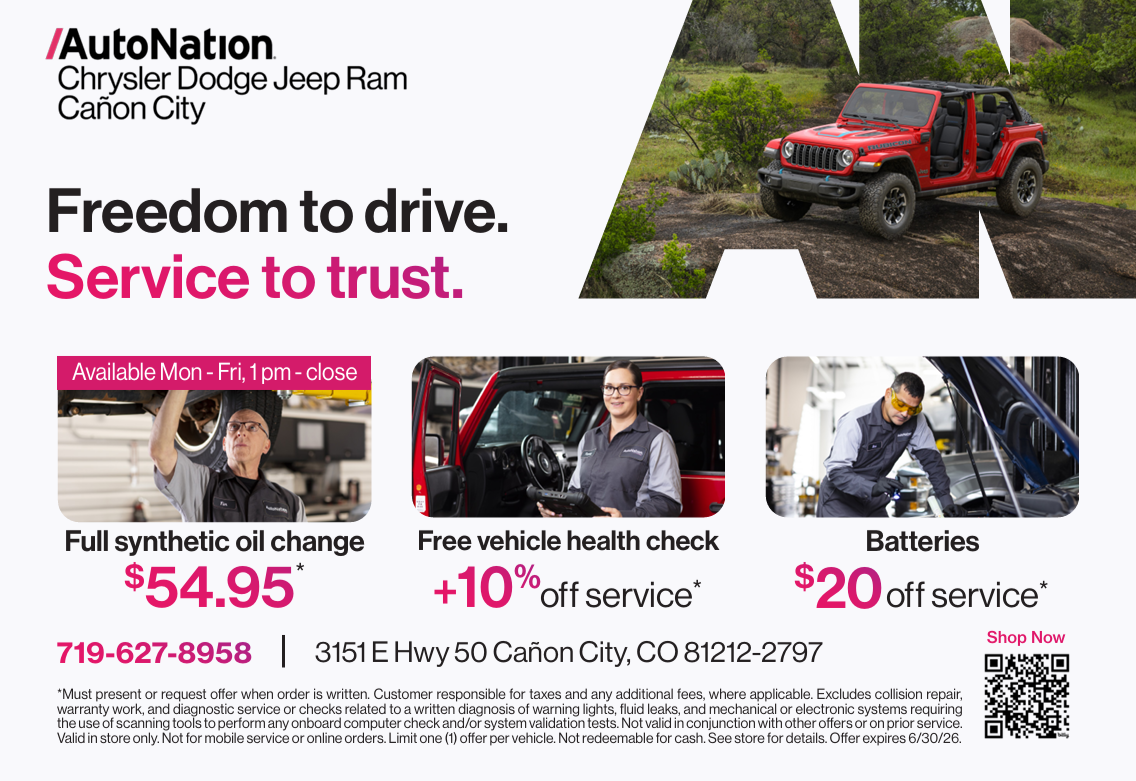 A promotional flyer for AutoNation Chrysler Dodge Jeep Ram in Cañon City showing a red Jeep with the slogan "Freedom to drive. Service to trust." The flyer advertises full synthetic oil change, free vehicle health check, and discounted batteries, with contact details and operating hours included.