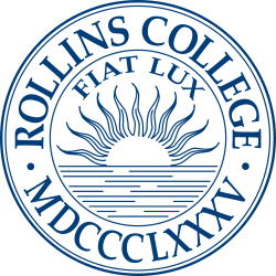 College seal for Rollins College featuring a sun rising over water with the words 'Rollins College', 'Fiat Lux', and Roman numerals.
