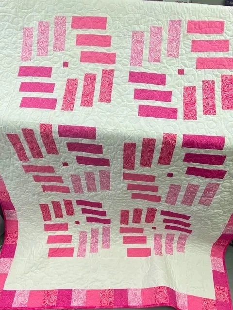 Finished quilt after quilting with Pro-Stitcher showing detailed stitching and texture