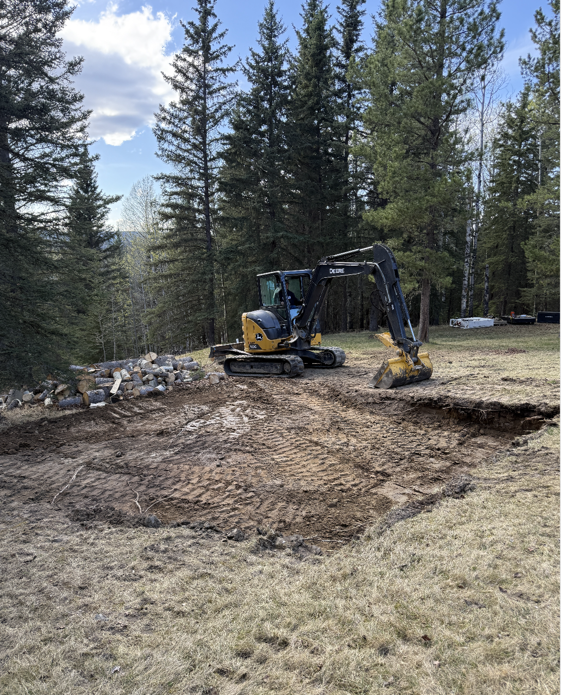 Skid steer performing excavation and site preparation work