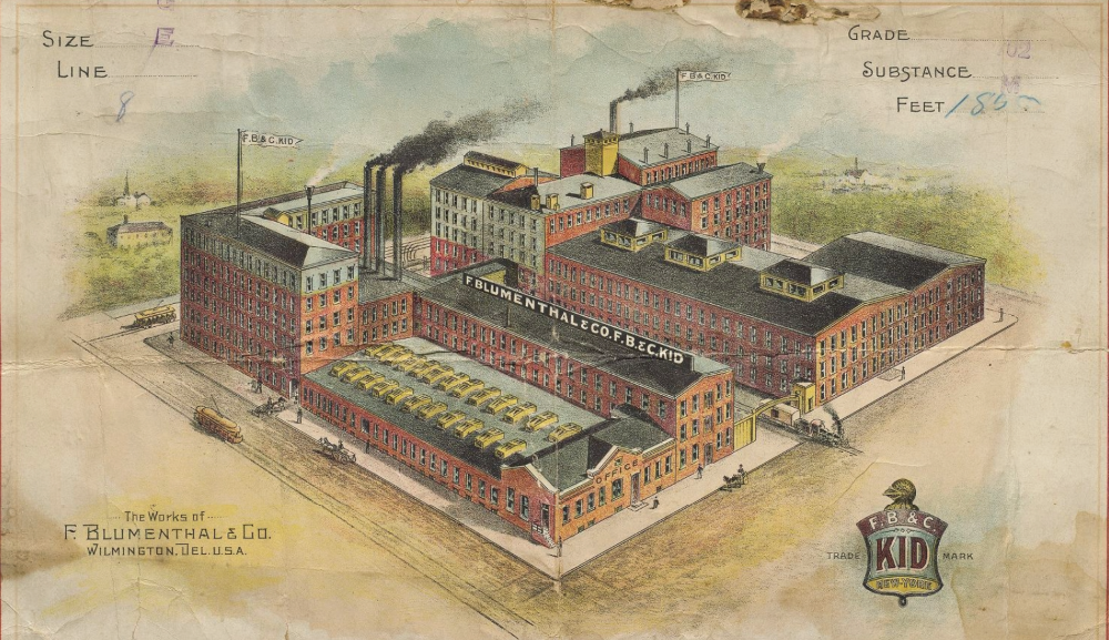 A vintage illustration of the F. Blumenthal Co. factory in Wilmington, Delaware, showing its multi-story brick buildings, smokestacks, a parking lot with yellow cars, and an office entrance with a sign. The factory is depicted in a historical style with detailed labeling.